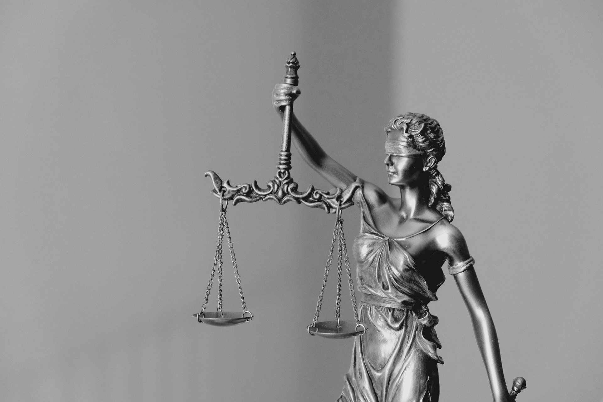 an abstract photo of a curved building with a blue sky in the background