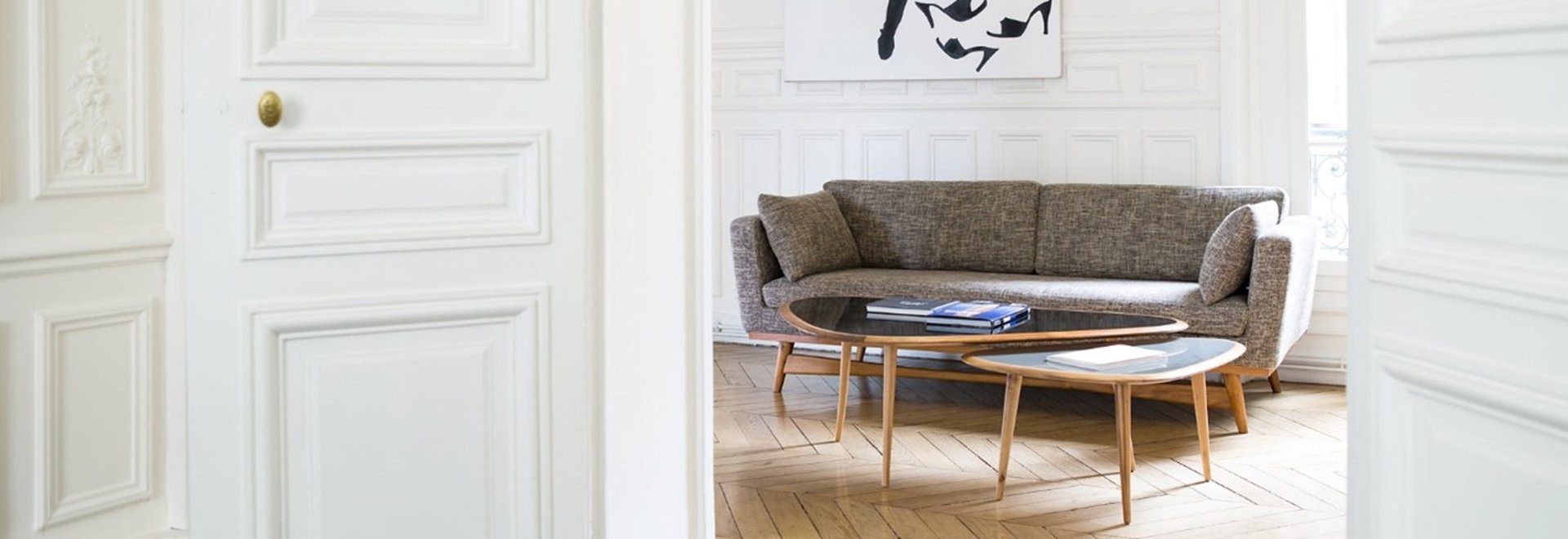three plants in pots near brown wooden door