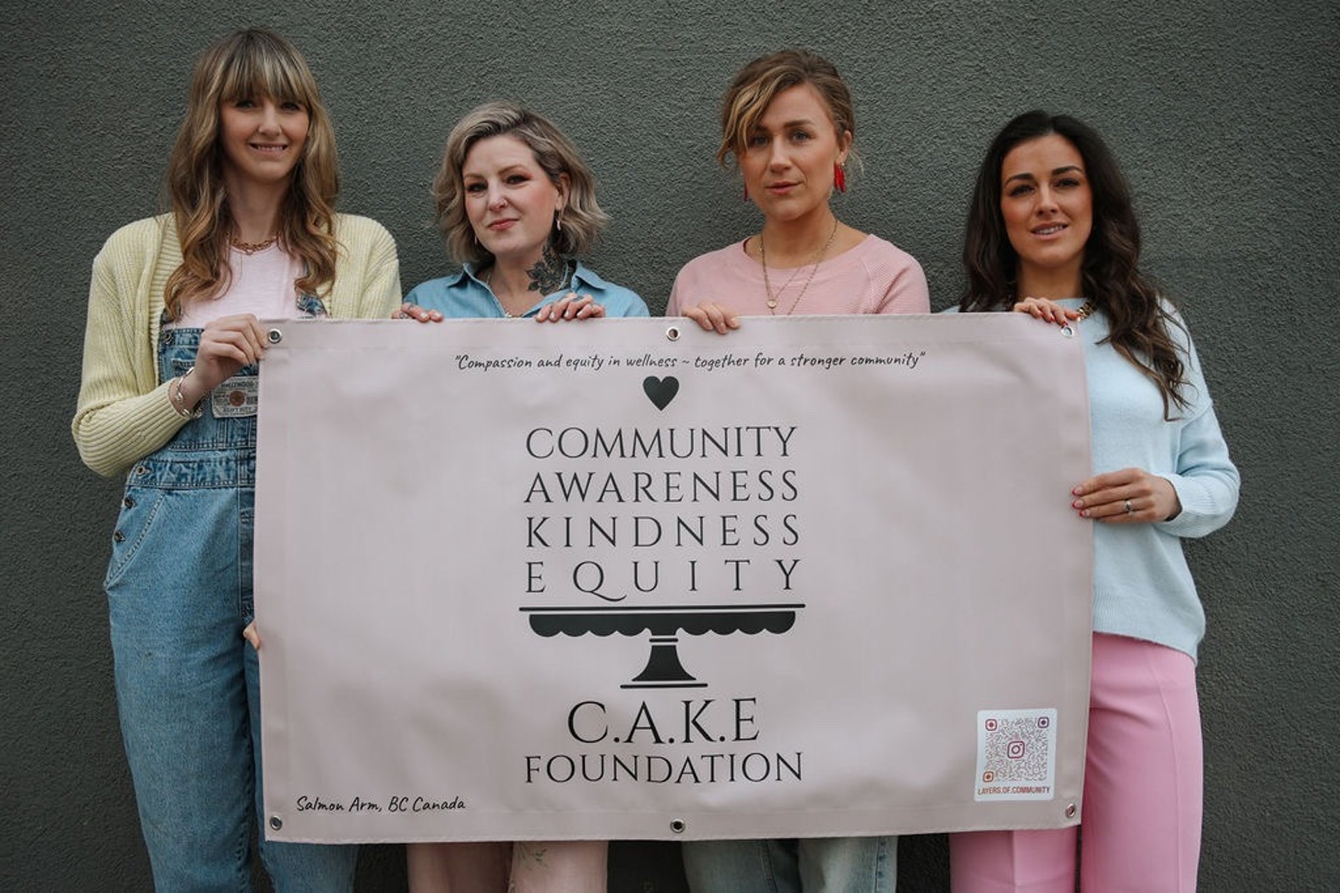 person holding white ceramic mugs