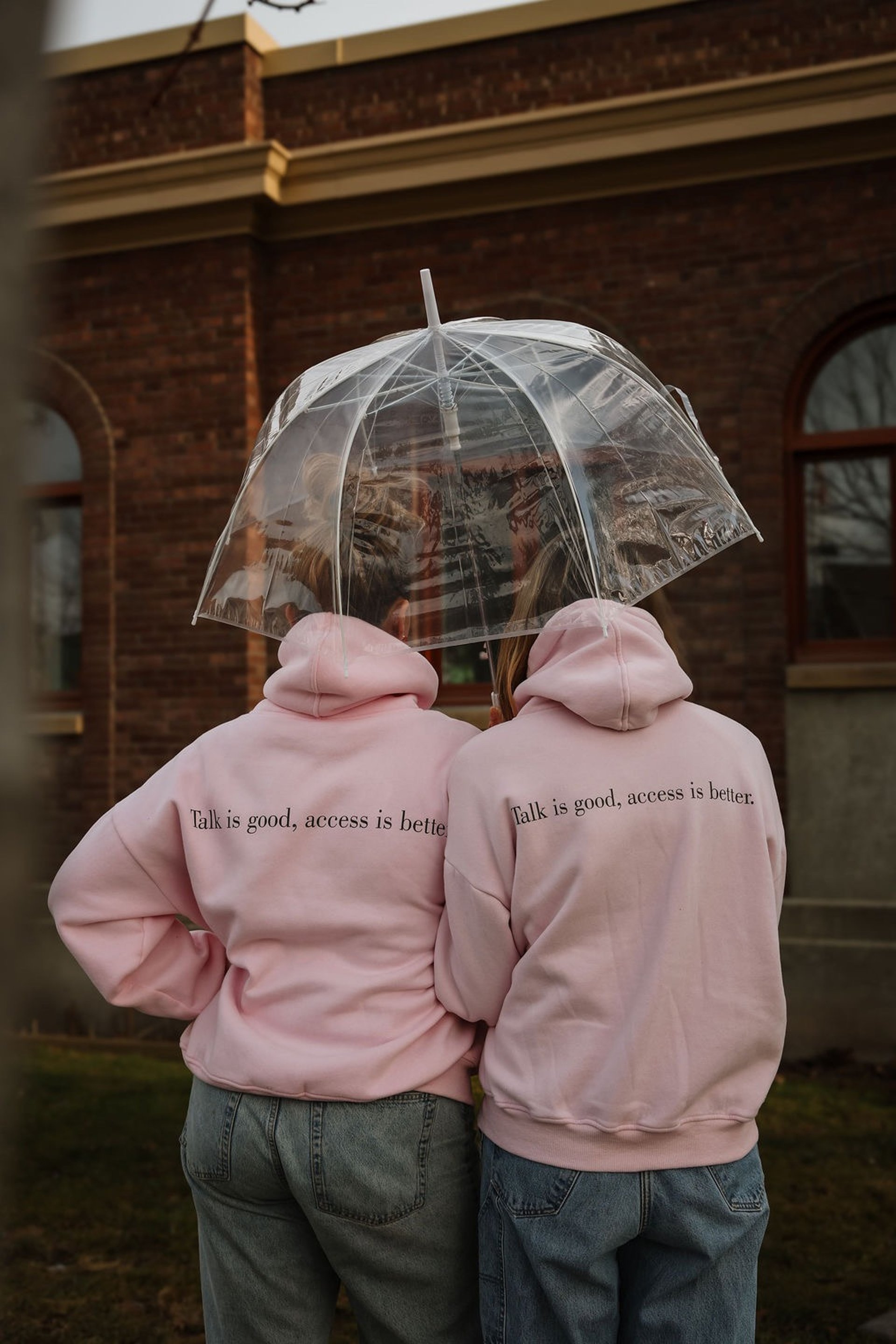a pink cake with white frosting and strawberries on top