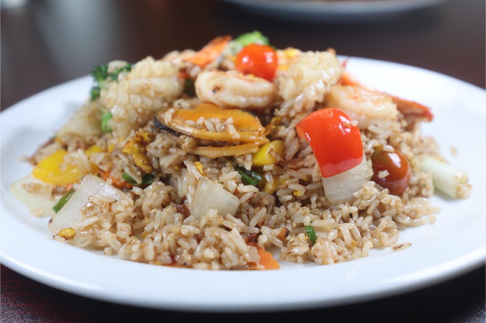 woman wearing yellow long-sleeved dress under white clouds and blue sky during daytime