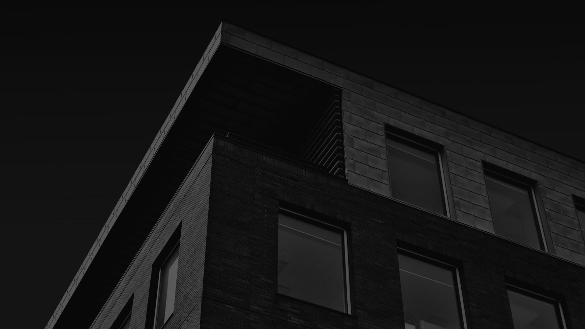 black and brown leather padded tub sofa