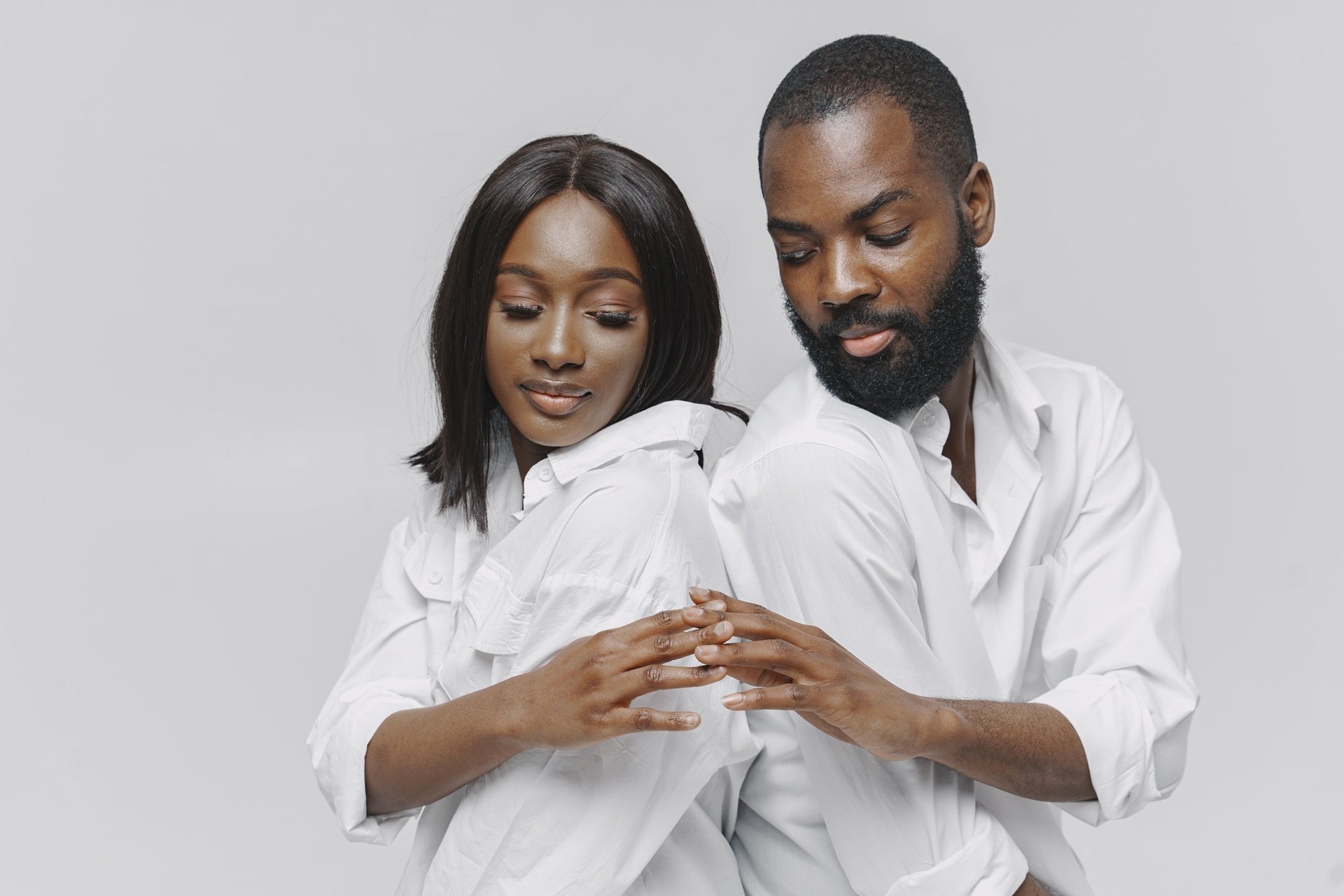 couple wearing silver-colored rings