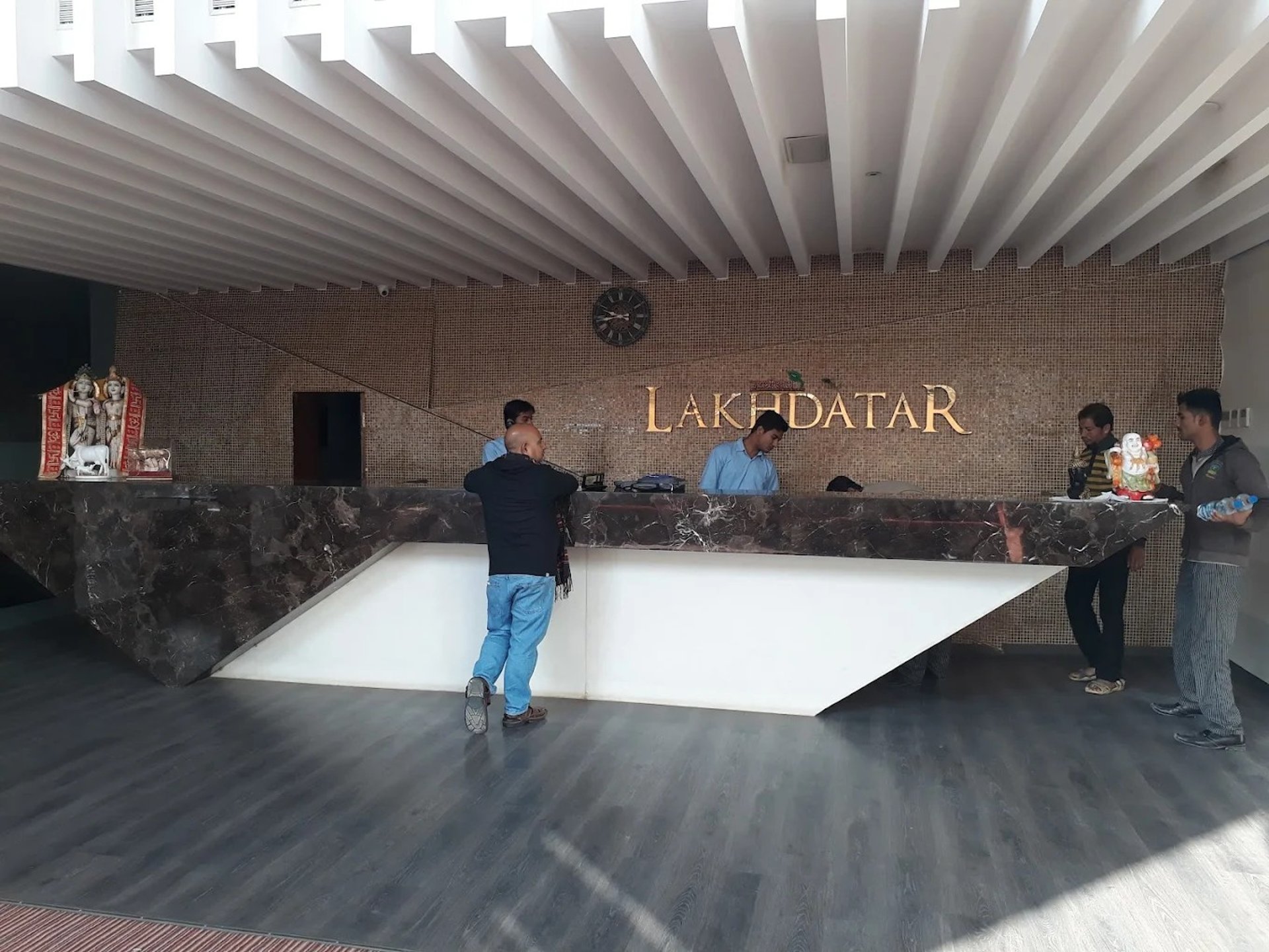 an abstract photo of a curved building with a blue sky in the background