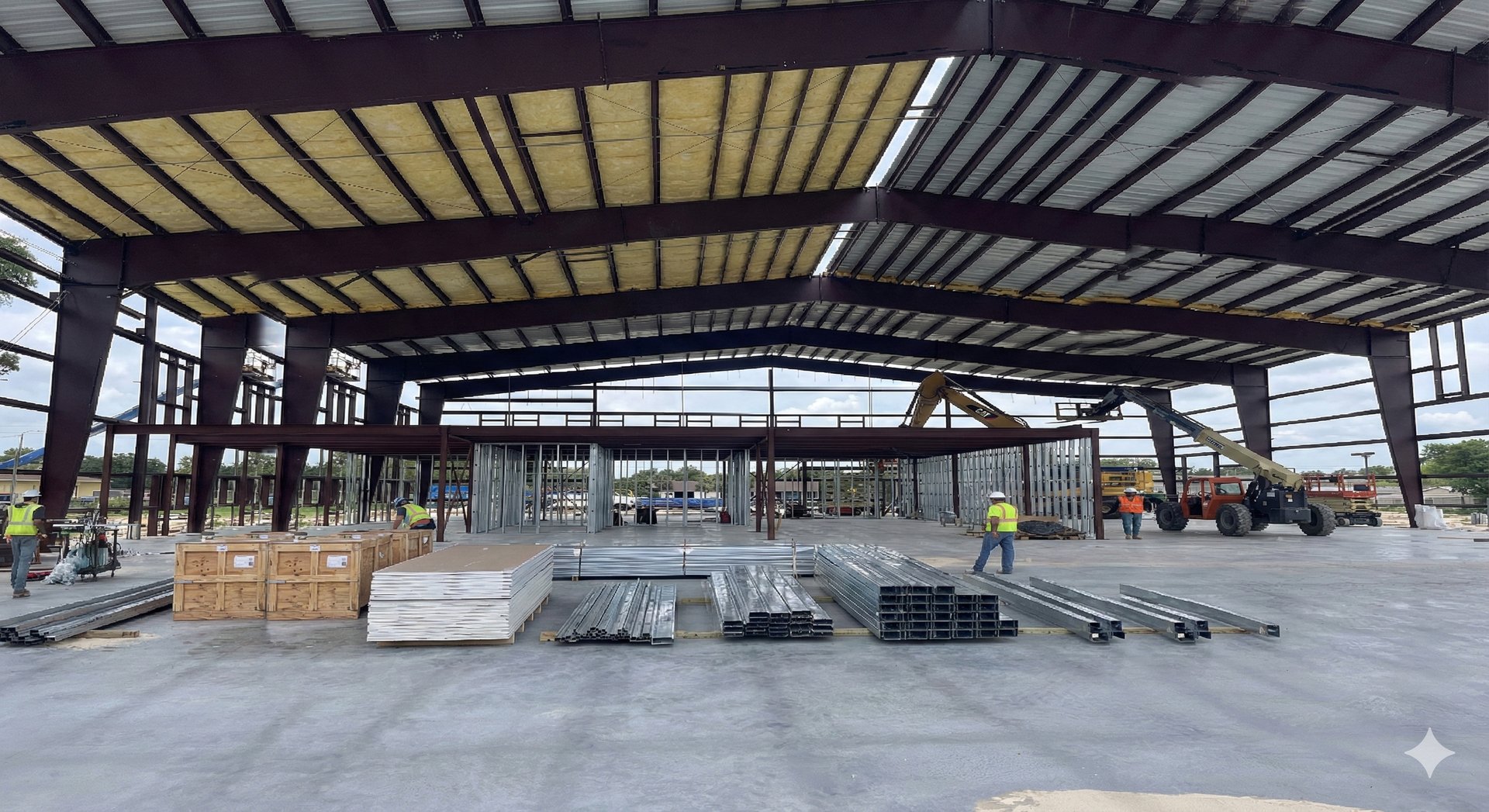 man standing and using measuring level on road