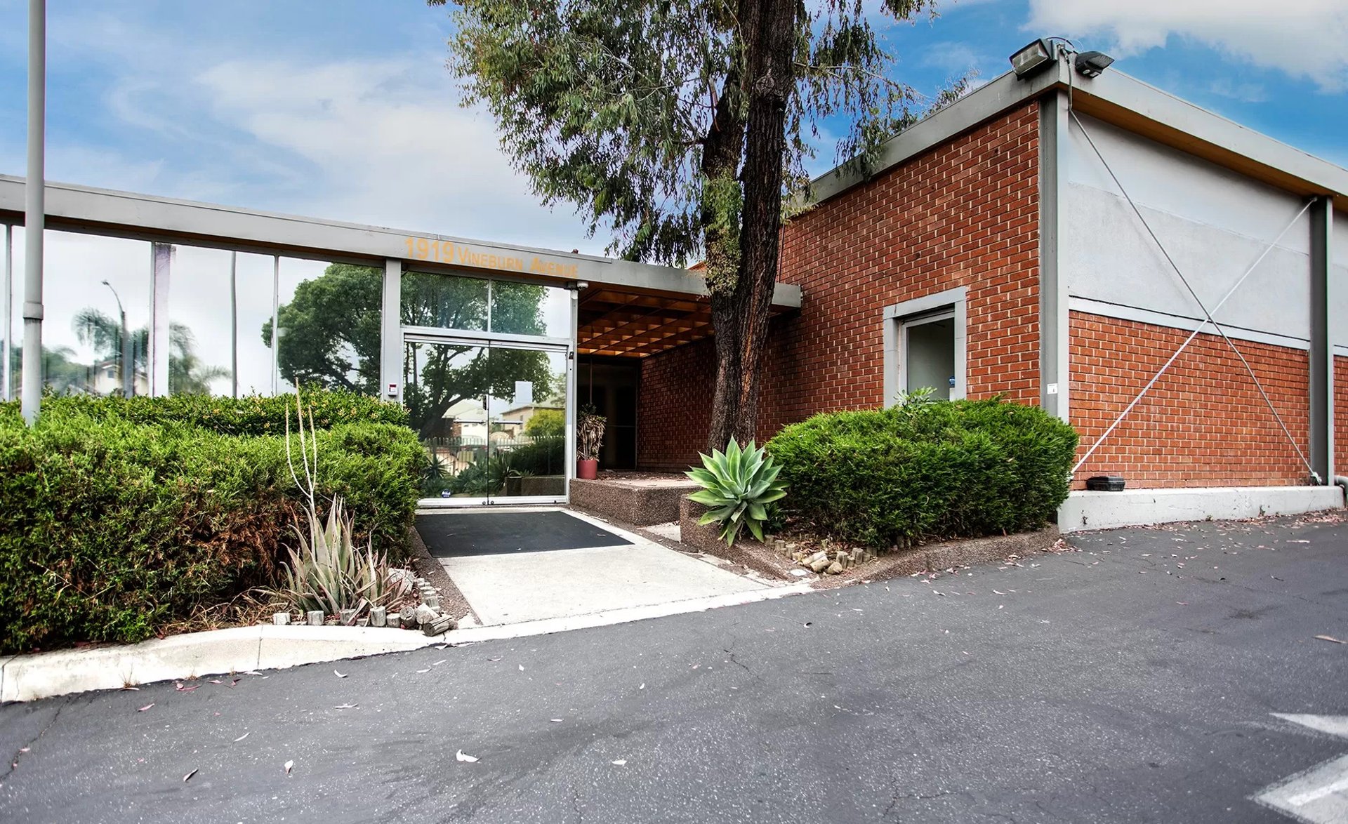 man in green zip up jacket using smartphone