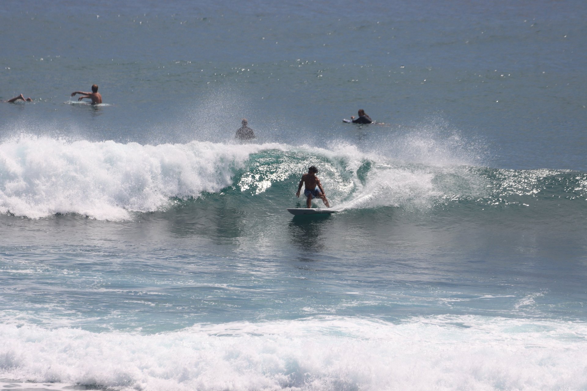 an abstract photo of a curved building with a blue sky in the background