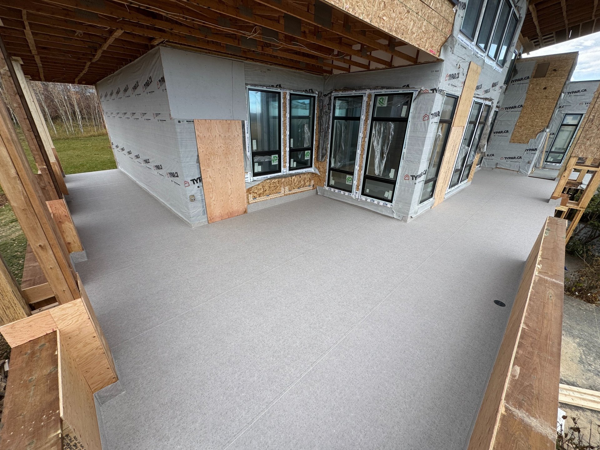 an abstract photo of a curved building with a blue sky in the background