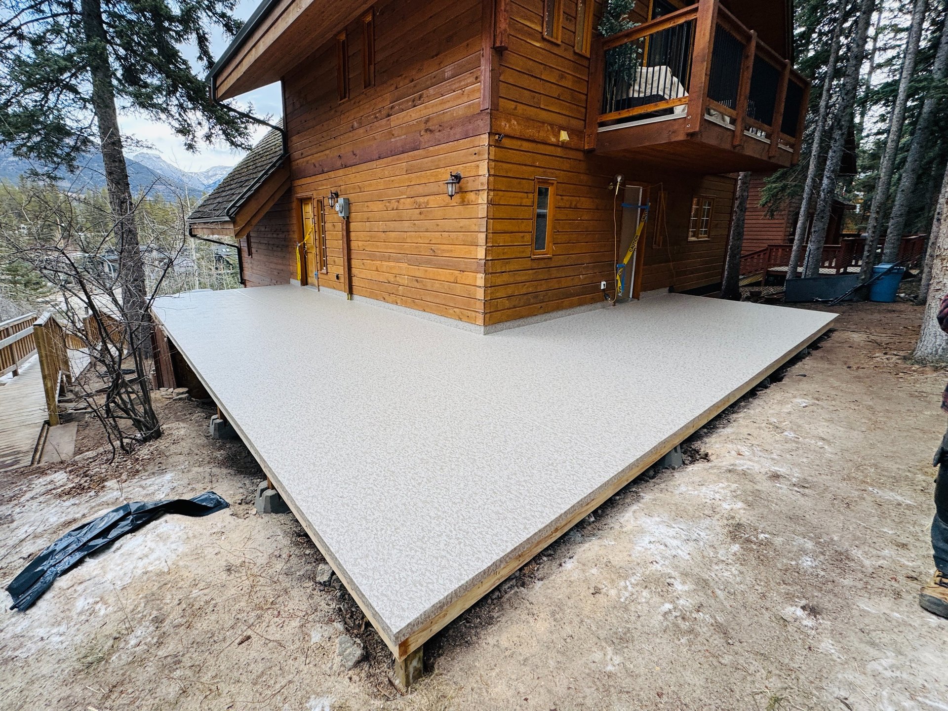 an abstract photo of a curved building with a blue sky in the background