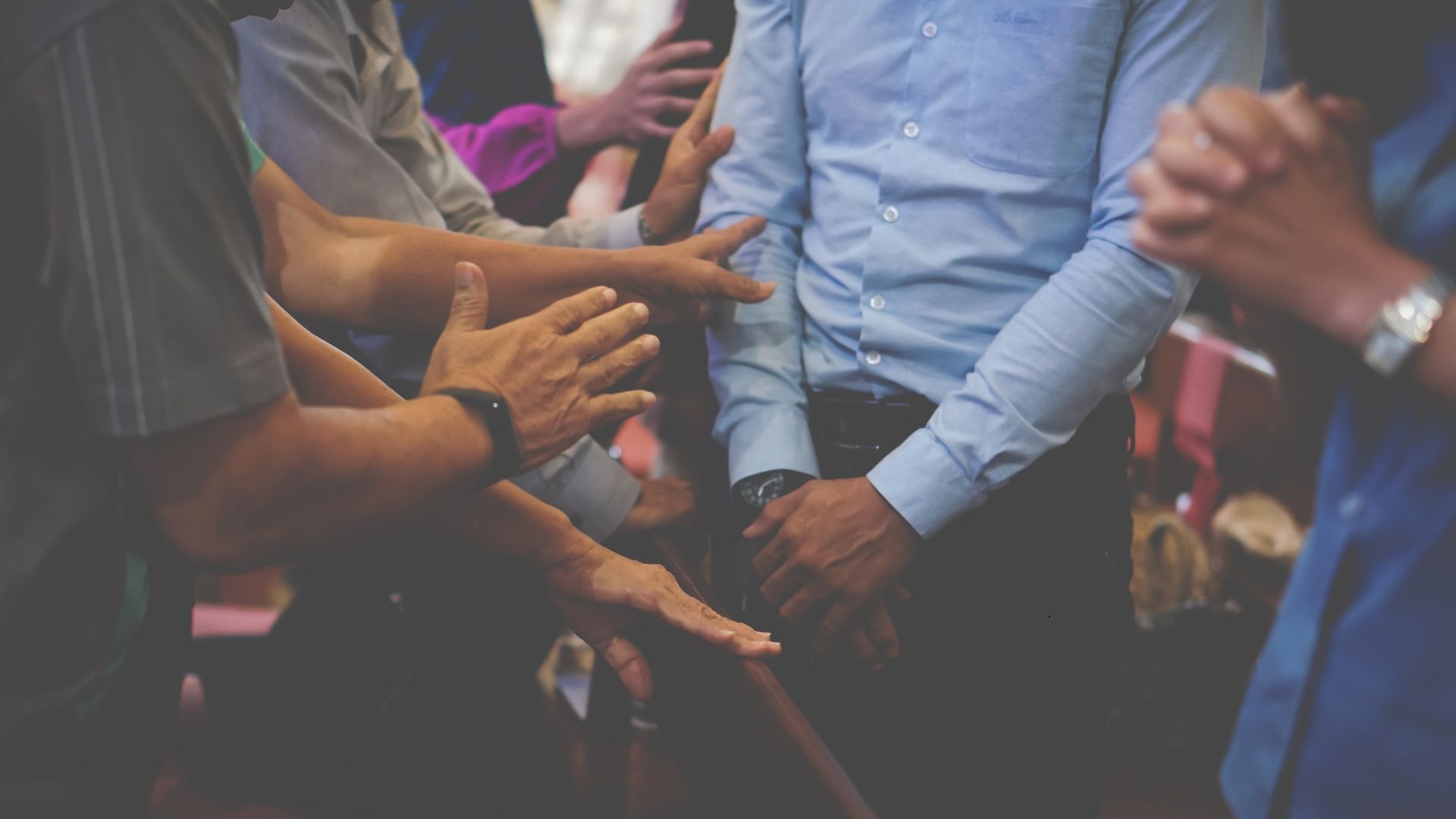 an abstract photo of a curved building with a blue sky in the background