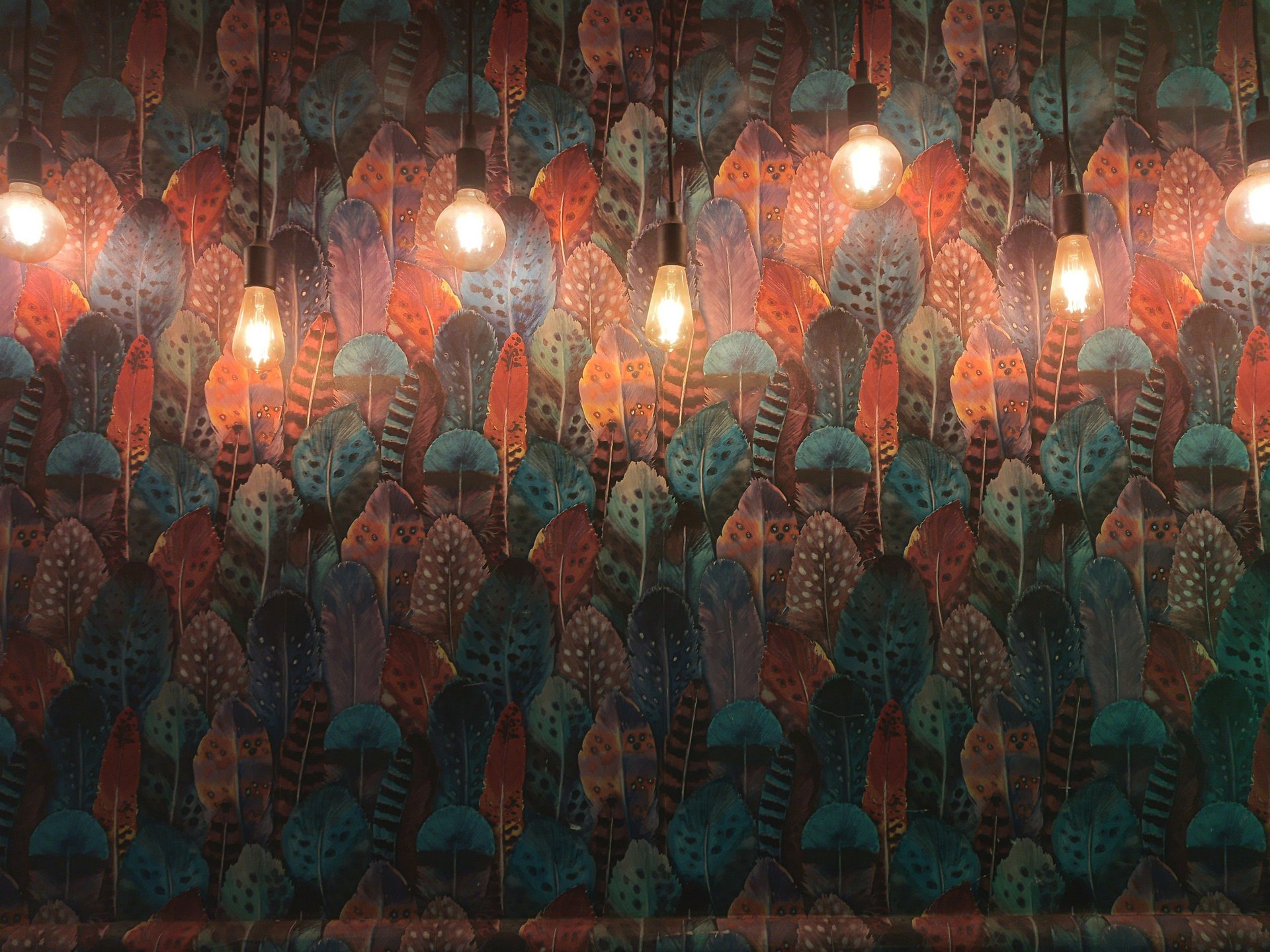 an abstract photo of a curved building with a blue sky in the background