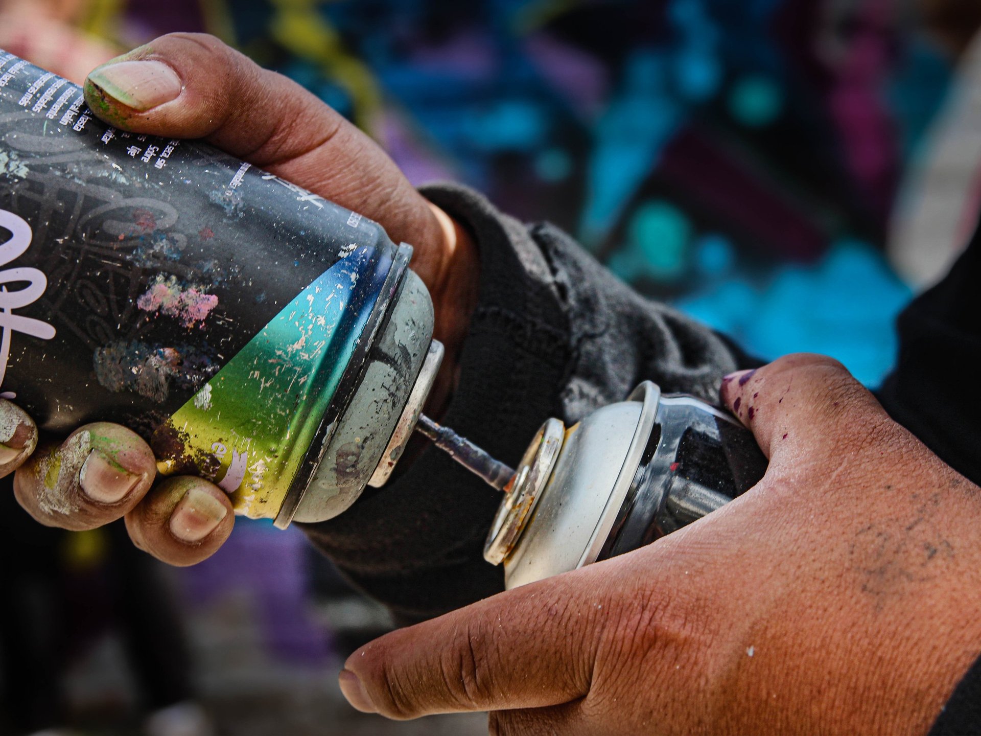 a close up of a black and brown abstract painting