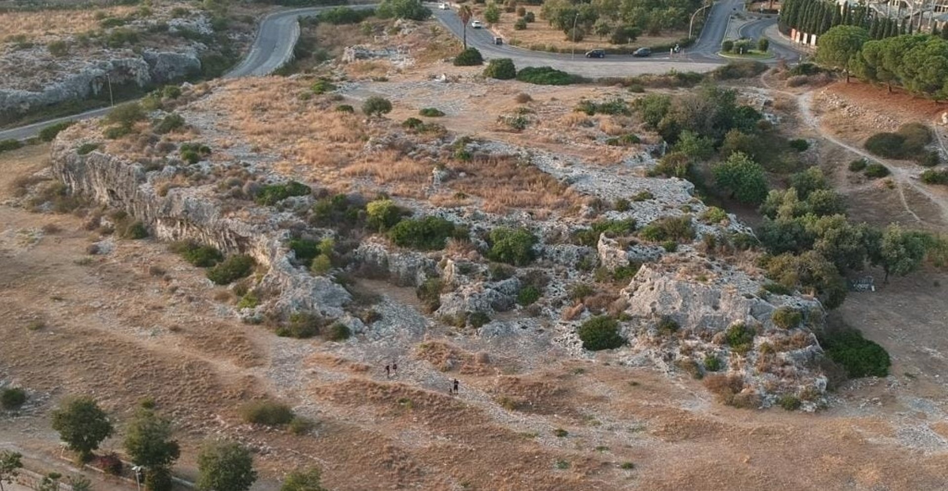 woman wearing yellow long-sleeved dress under white clouds and blue sky during daytime