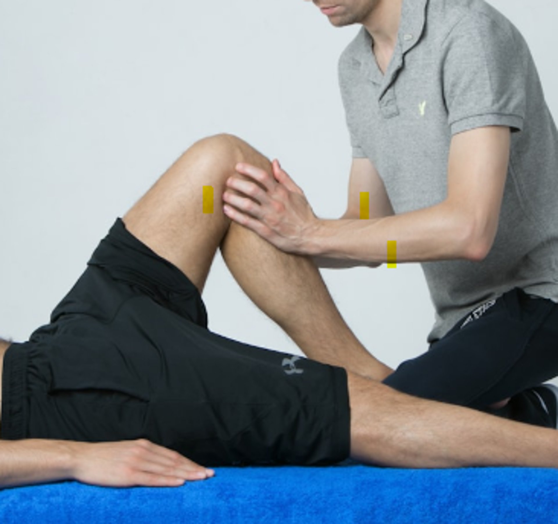a man getting his leg examined by a doctor
