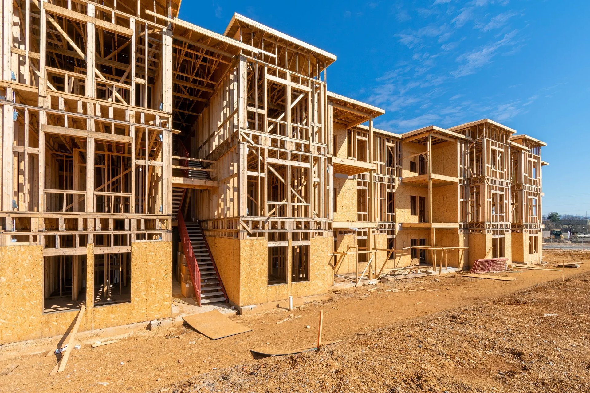 an abstract photo of a curved building with a blue sky in the background
