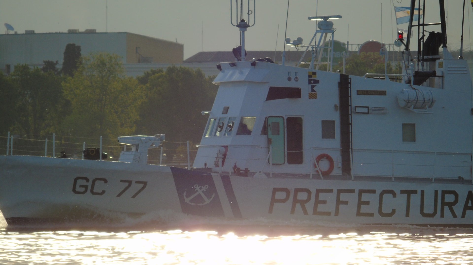 an abstract photo of a curved building with a blue sky in the background