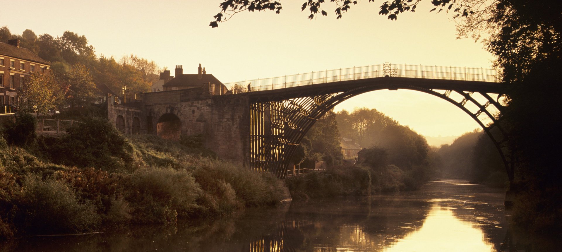 an abstract photo of a curved building with a blue sky in the background
