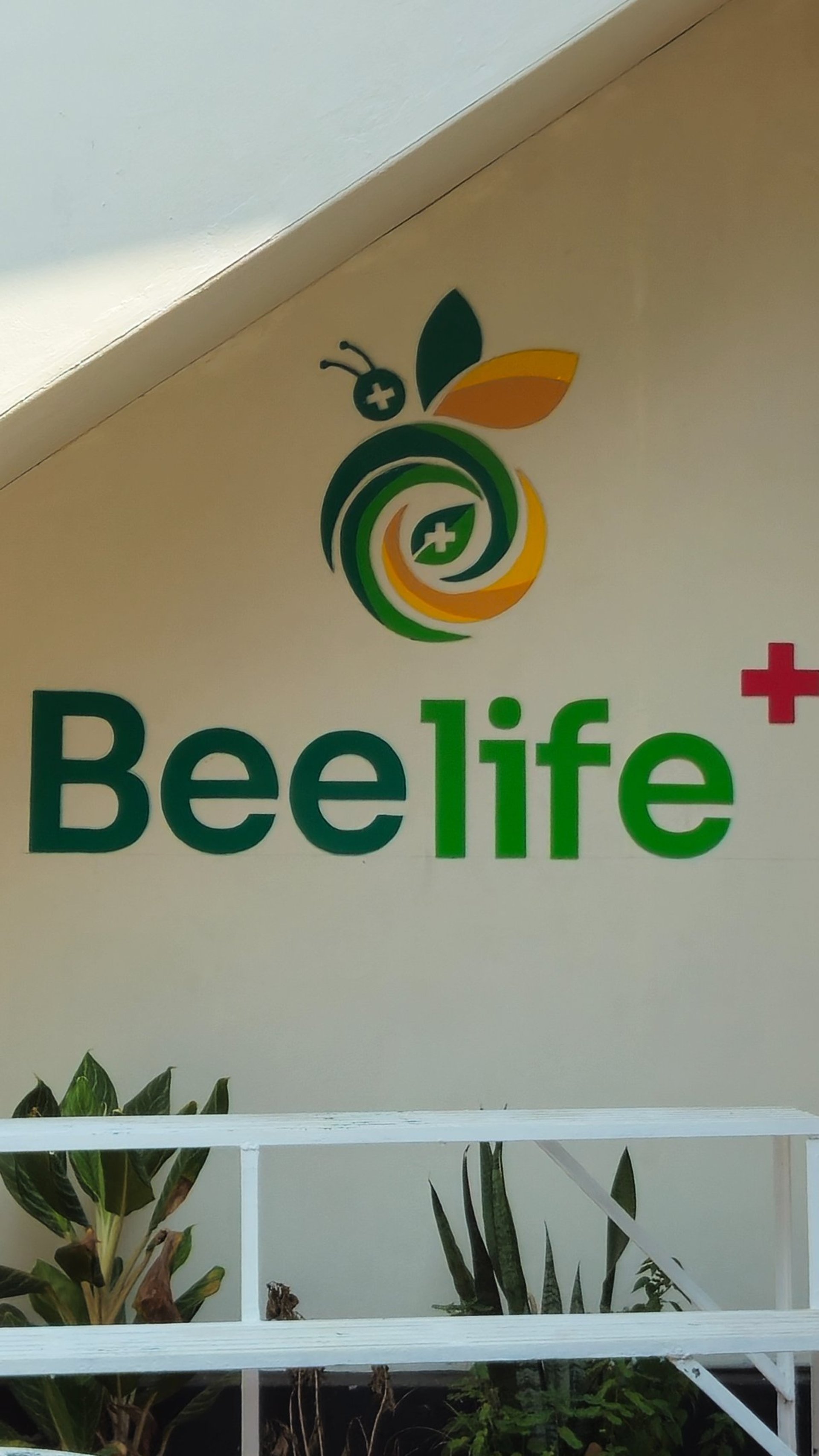 Doctor talks to mother and son in office.