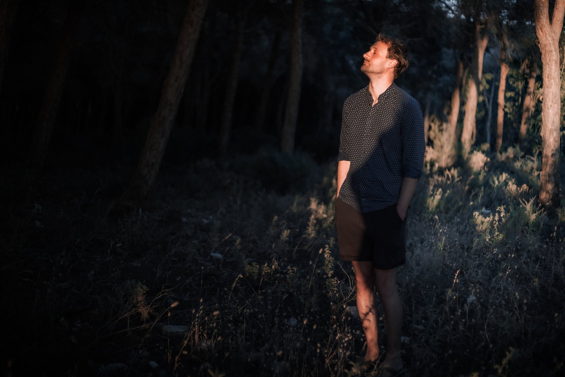 woman wearing yellow long-sleeved dress under white clouds and blue sky during daytime