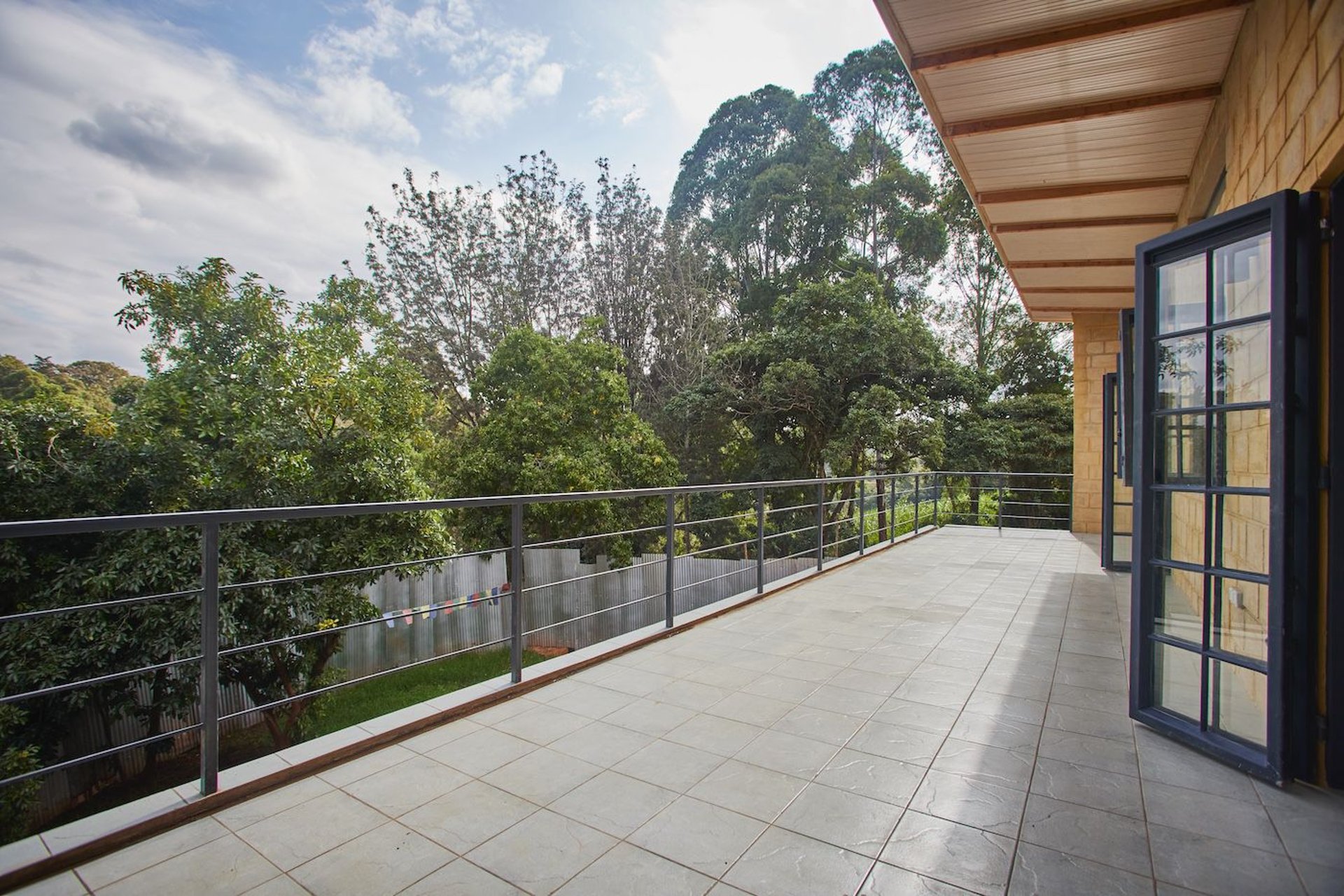 woman wearing yellow long-sleeved dress under white clouds and blue sky during daytime