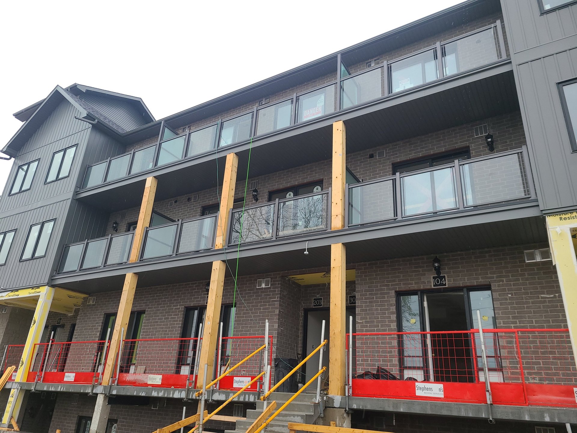 an abstract photo of a curved building with a blue sky in the background