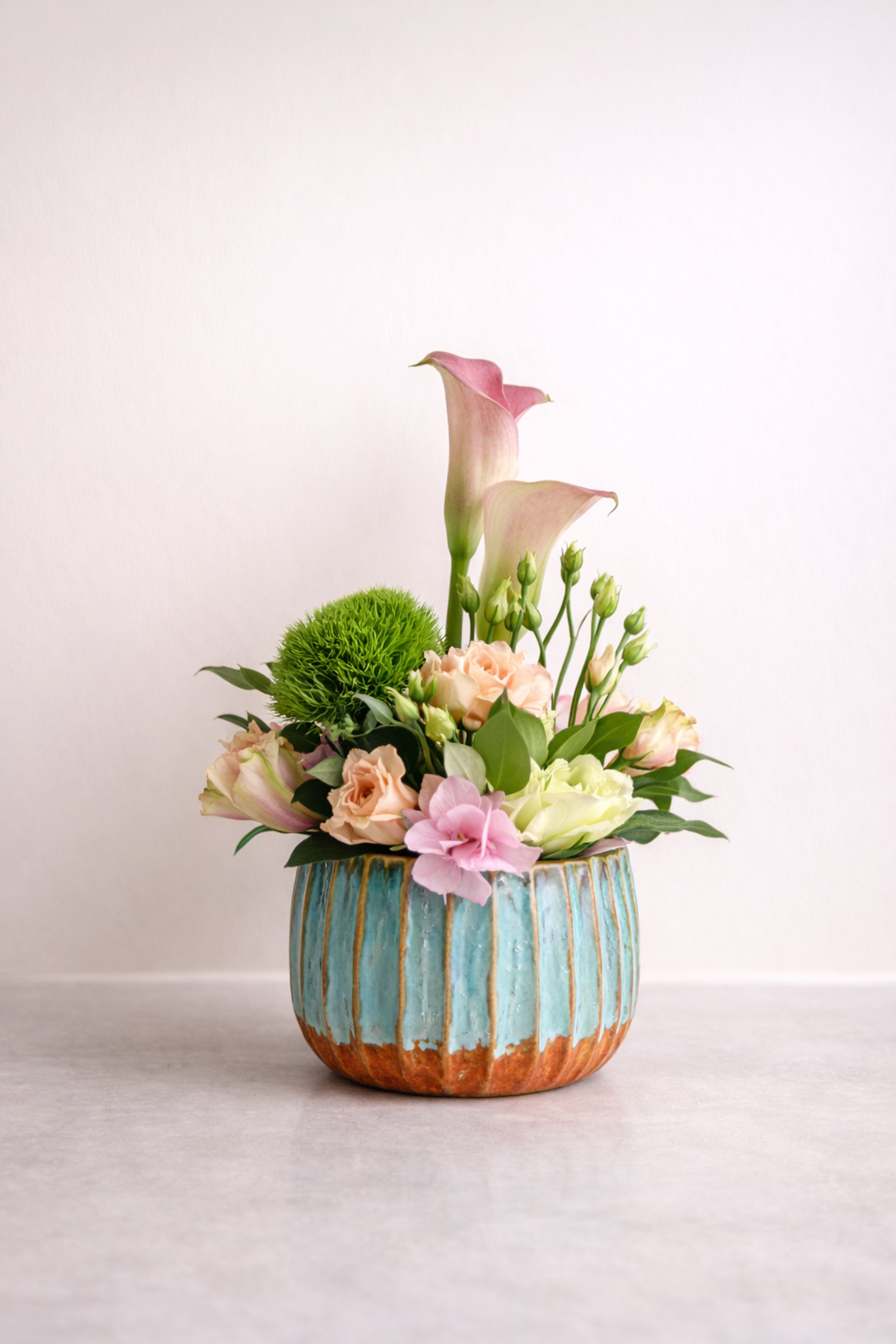 an abstract photo of a curved building with a blue sky in the background