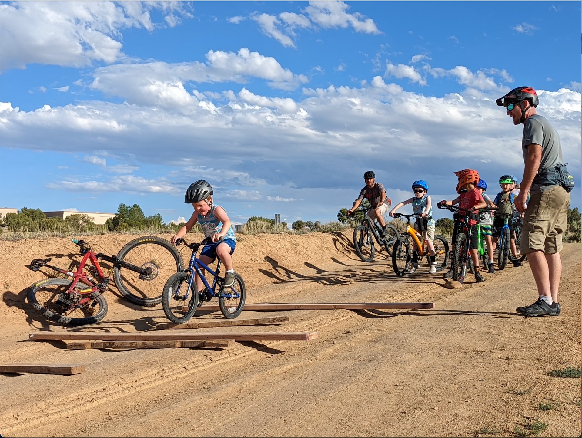 an abstract photo of a curved building with a blue sky in the background