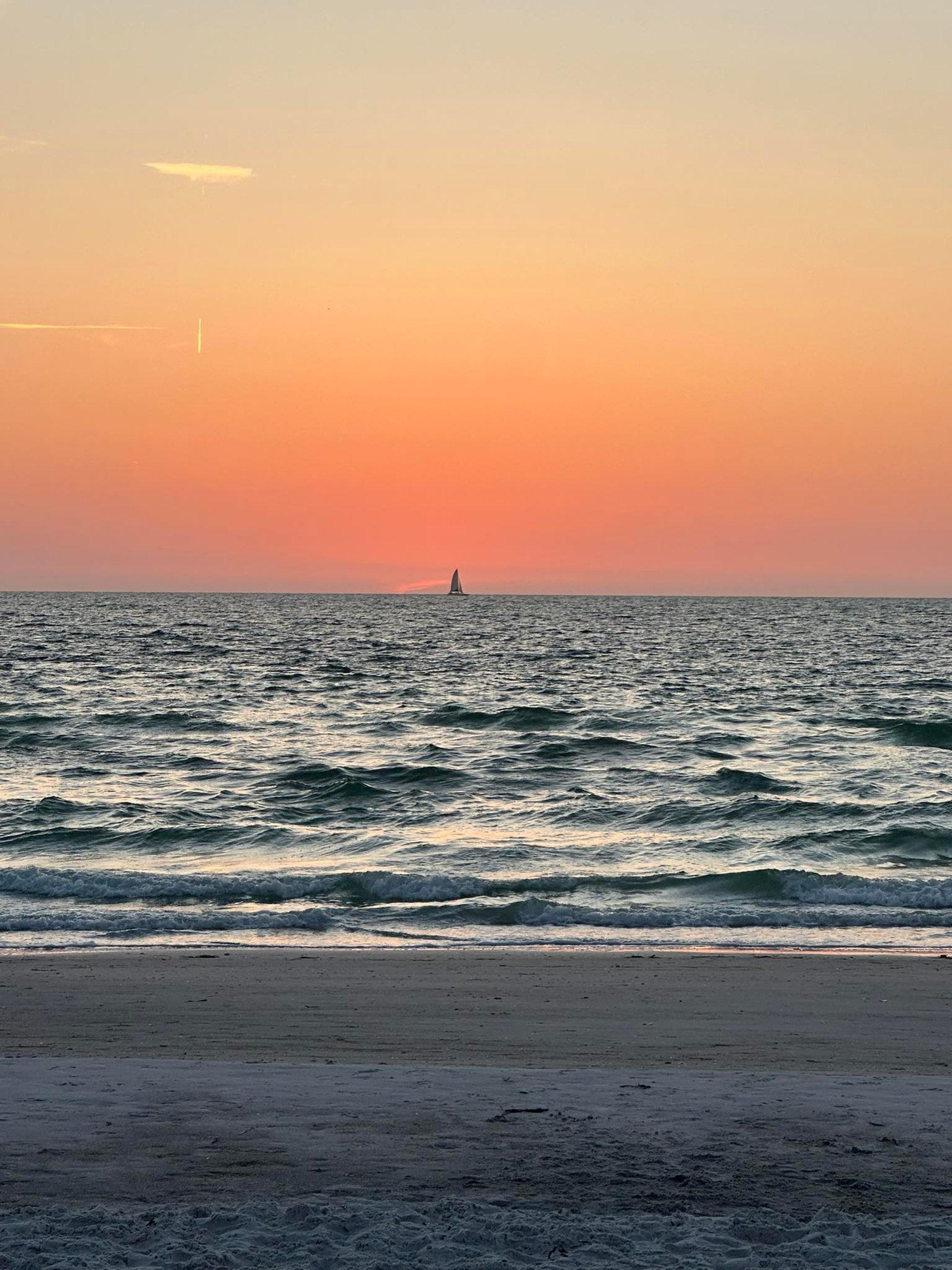 an abstract photo of a curved building with a blue sky in the background
