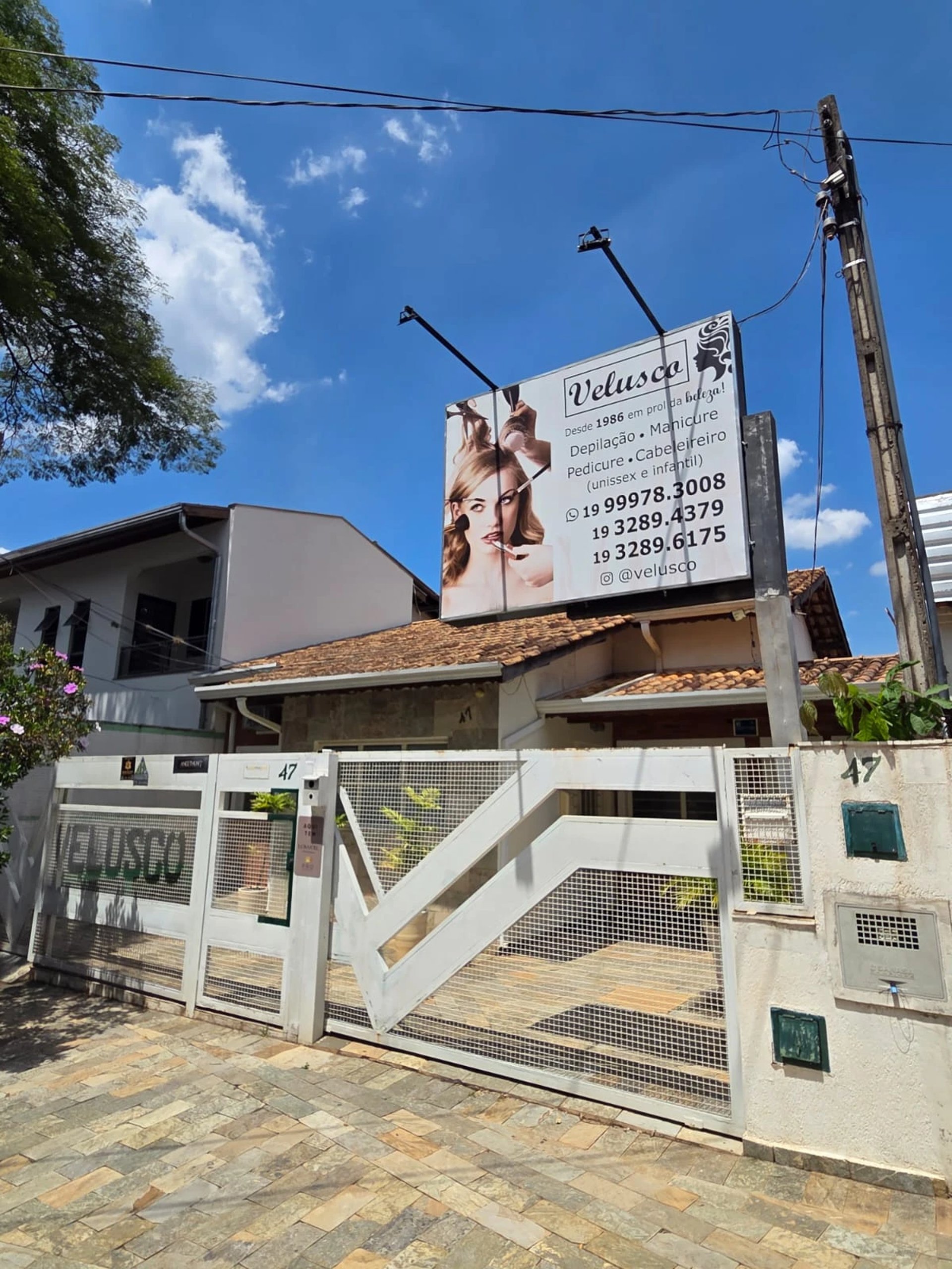 woman wearing yellow long-sleeved dress under white clouds and blue sky during daytime