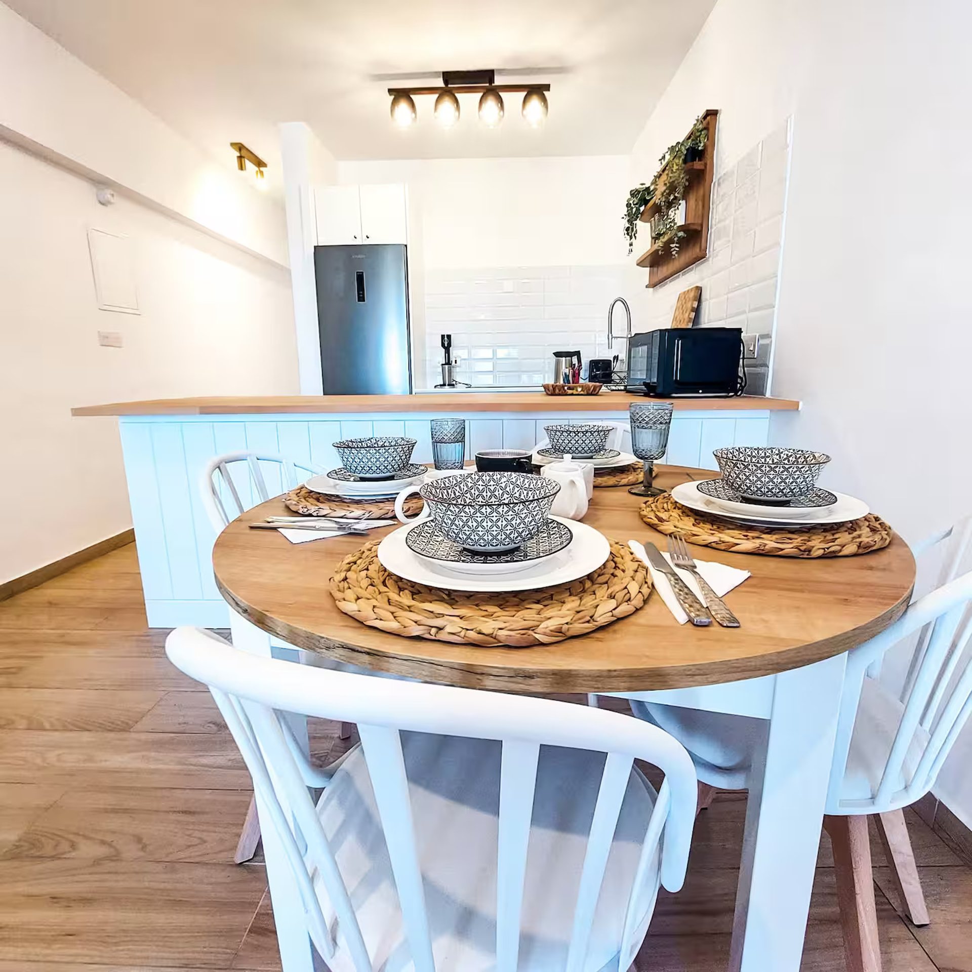 Modern dining room with oval table and chairs.