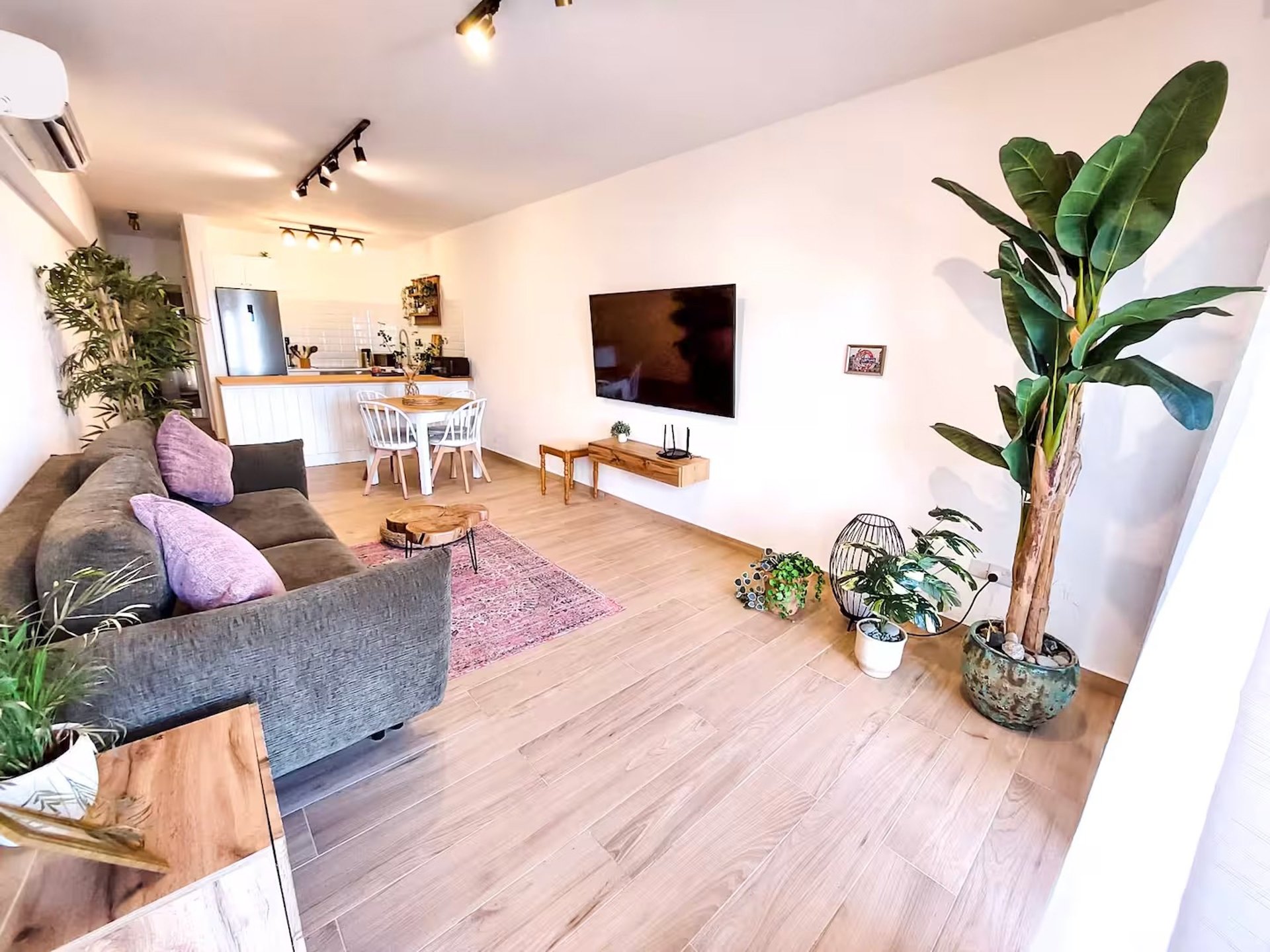 a living room filled with furniture and a large window