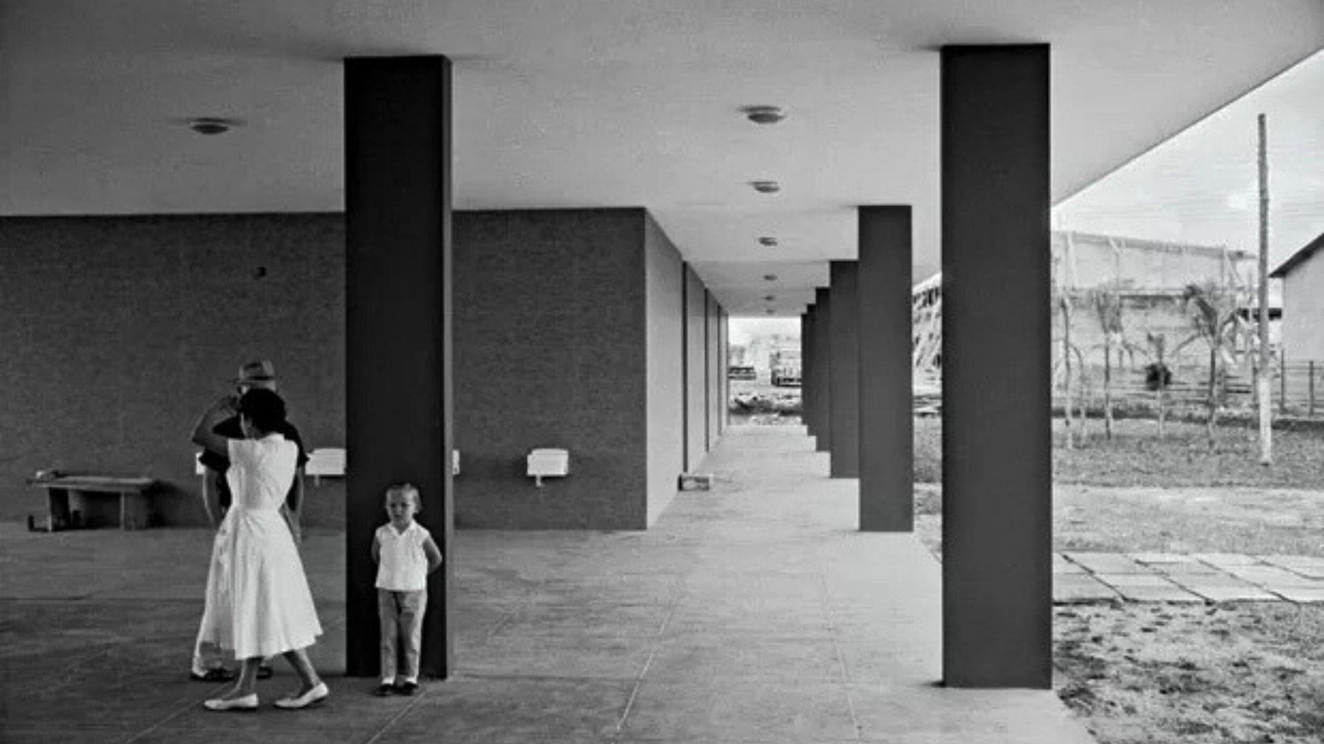 woman wearing yellow long-sleeved dress under white clouds and blue sky during daytime