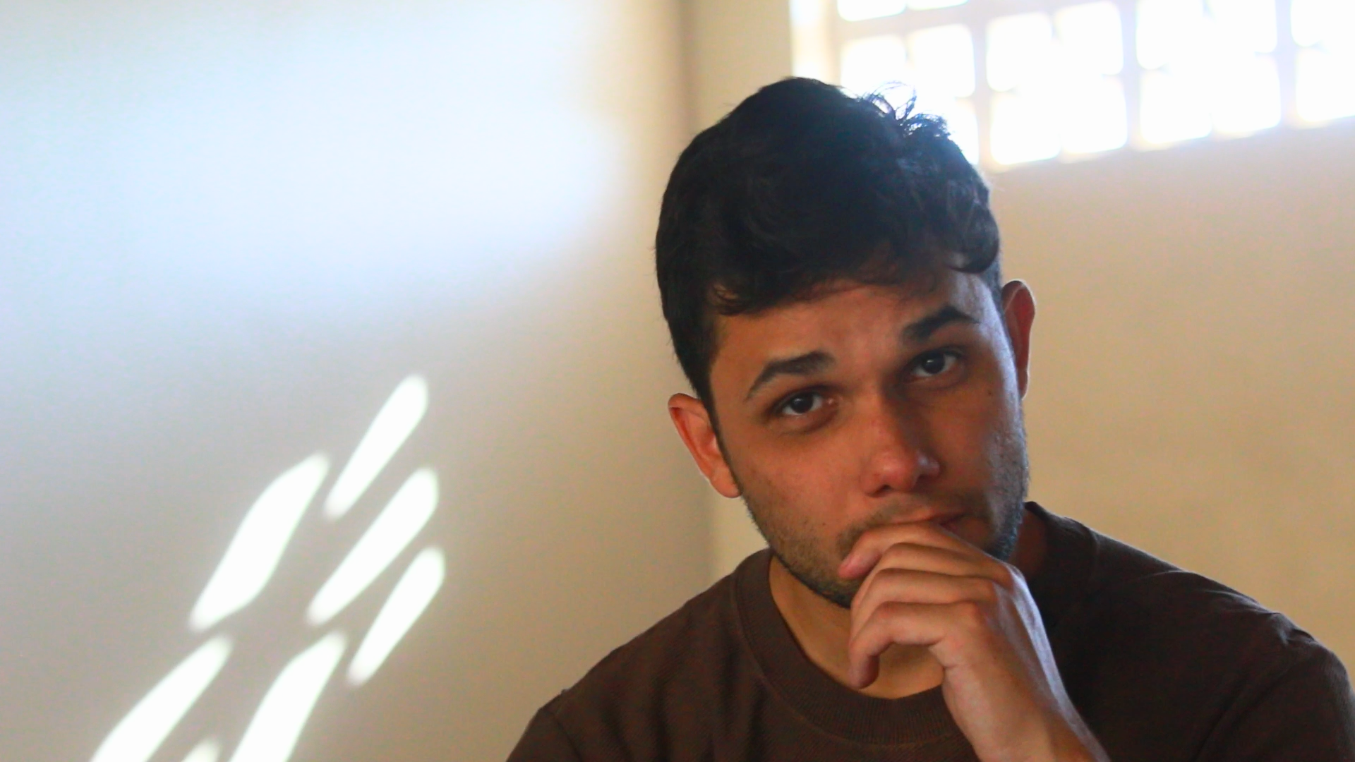 an abstract photo of a curved building with a blue sky in the background