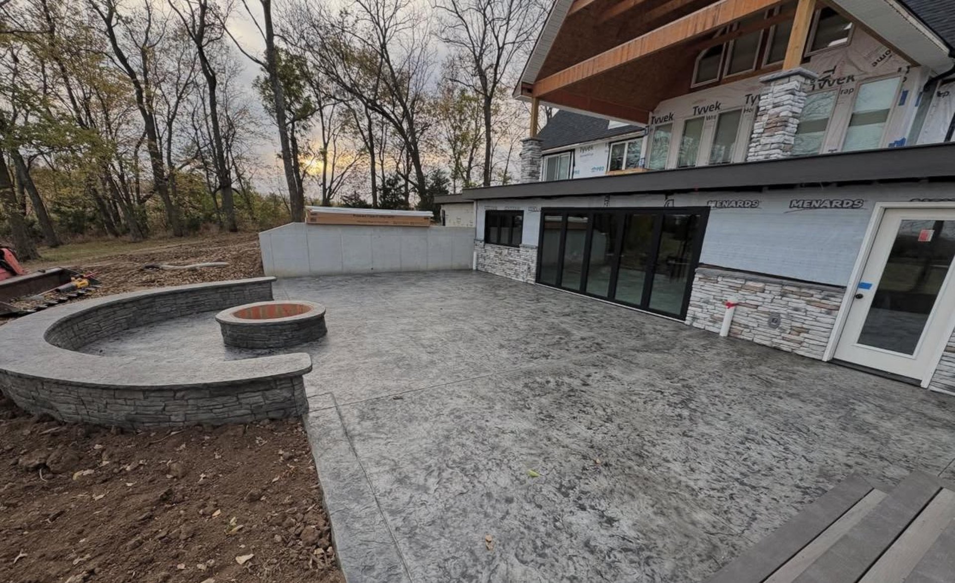 a man in an orange shirt is holding a skateboard