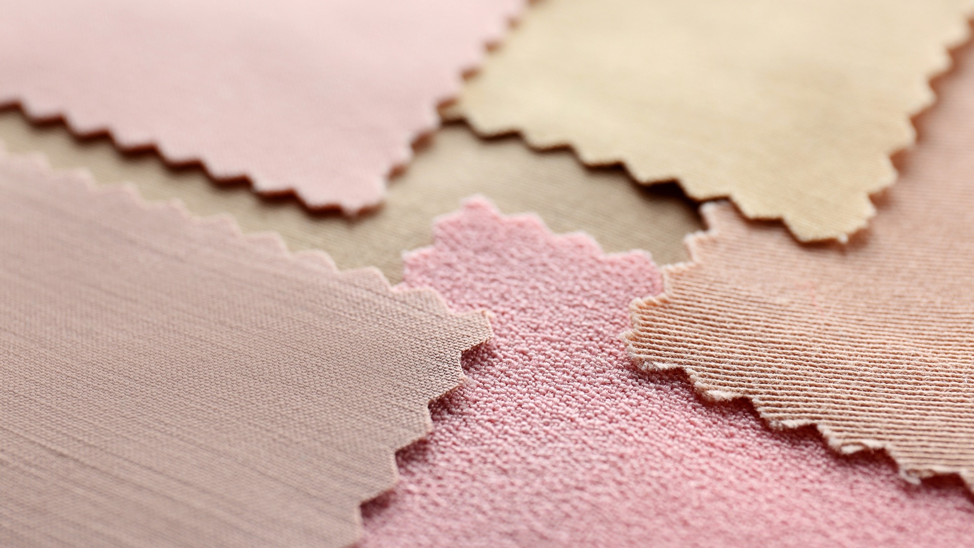 an abstract photo of a curved building with a blue sky in the background