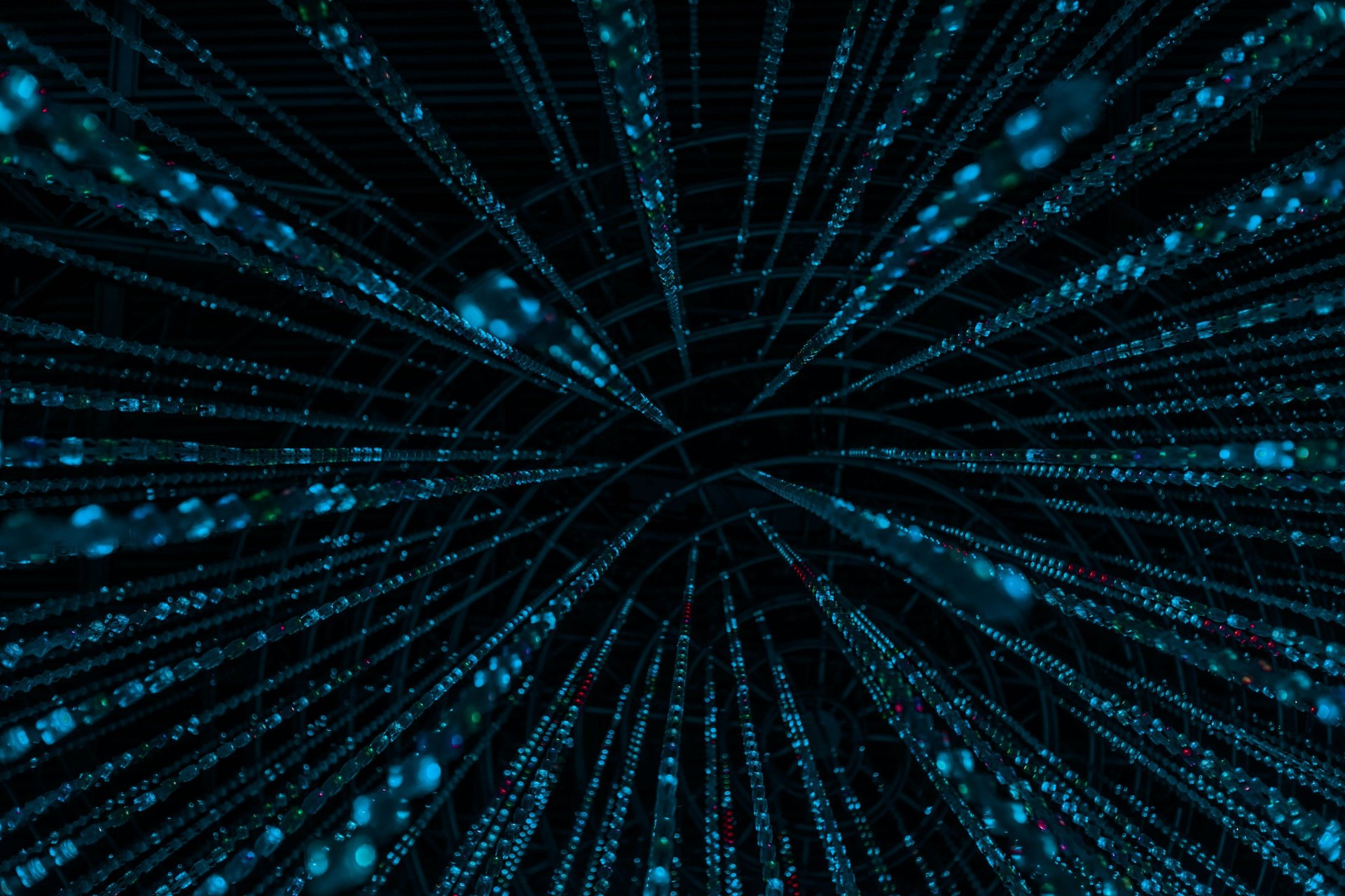 an abstract photo of a curved building with a blue sky in the background