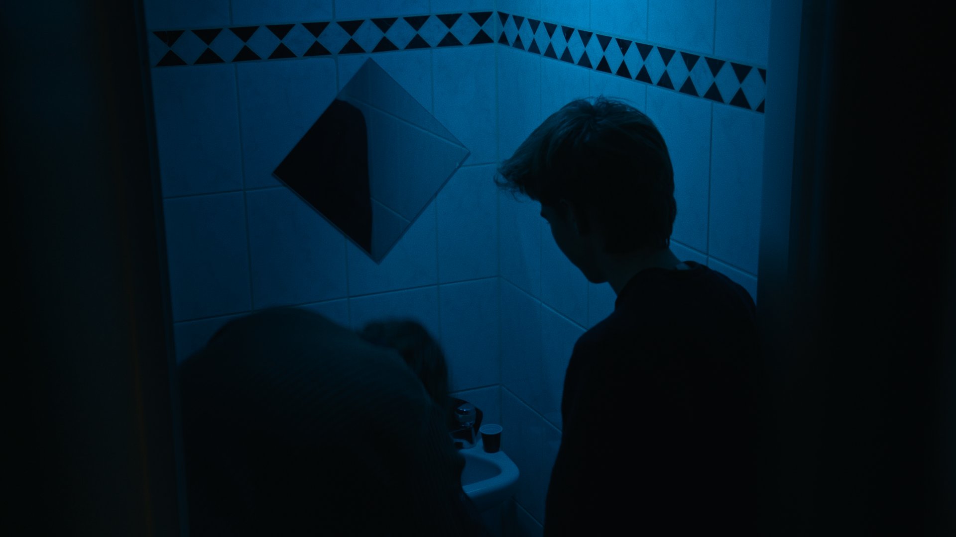 an abstract photo of a curved building with a blue sky in the background