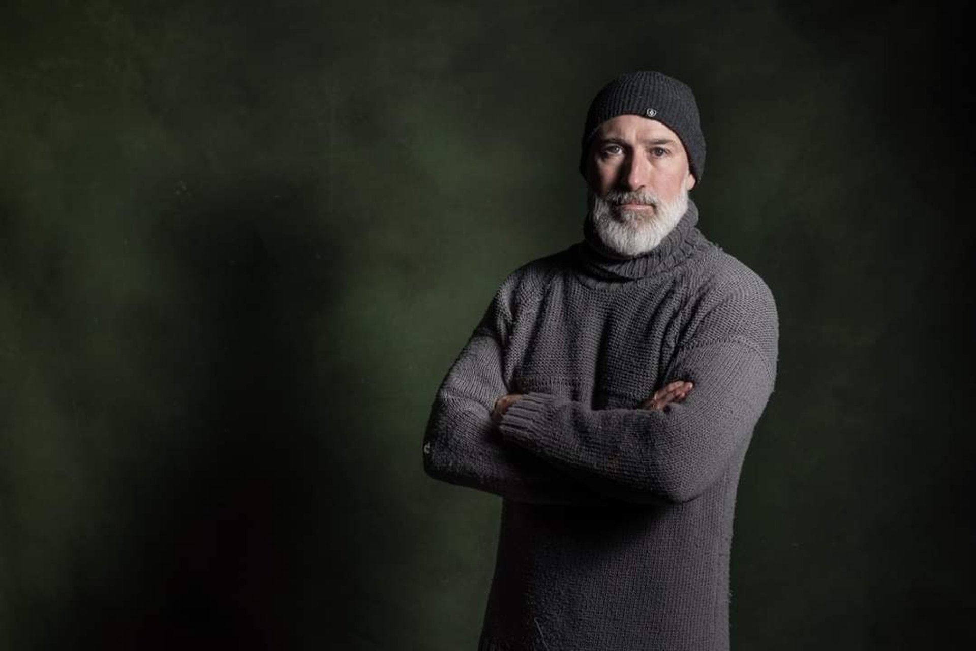 man in sweater wearing eyeglasses