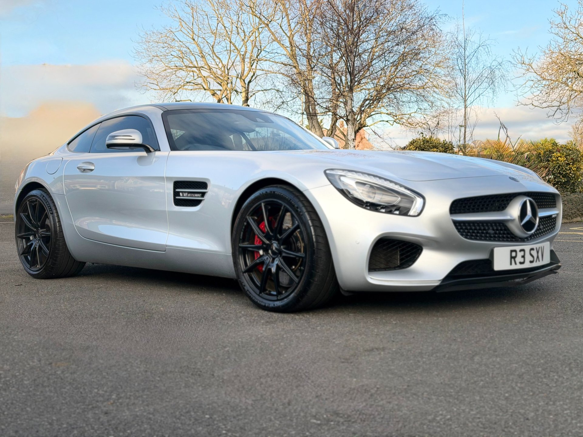 white lamborghini aventador parked in building