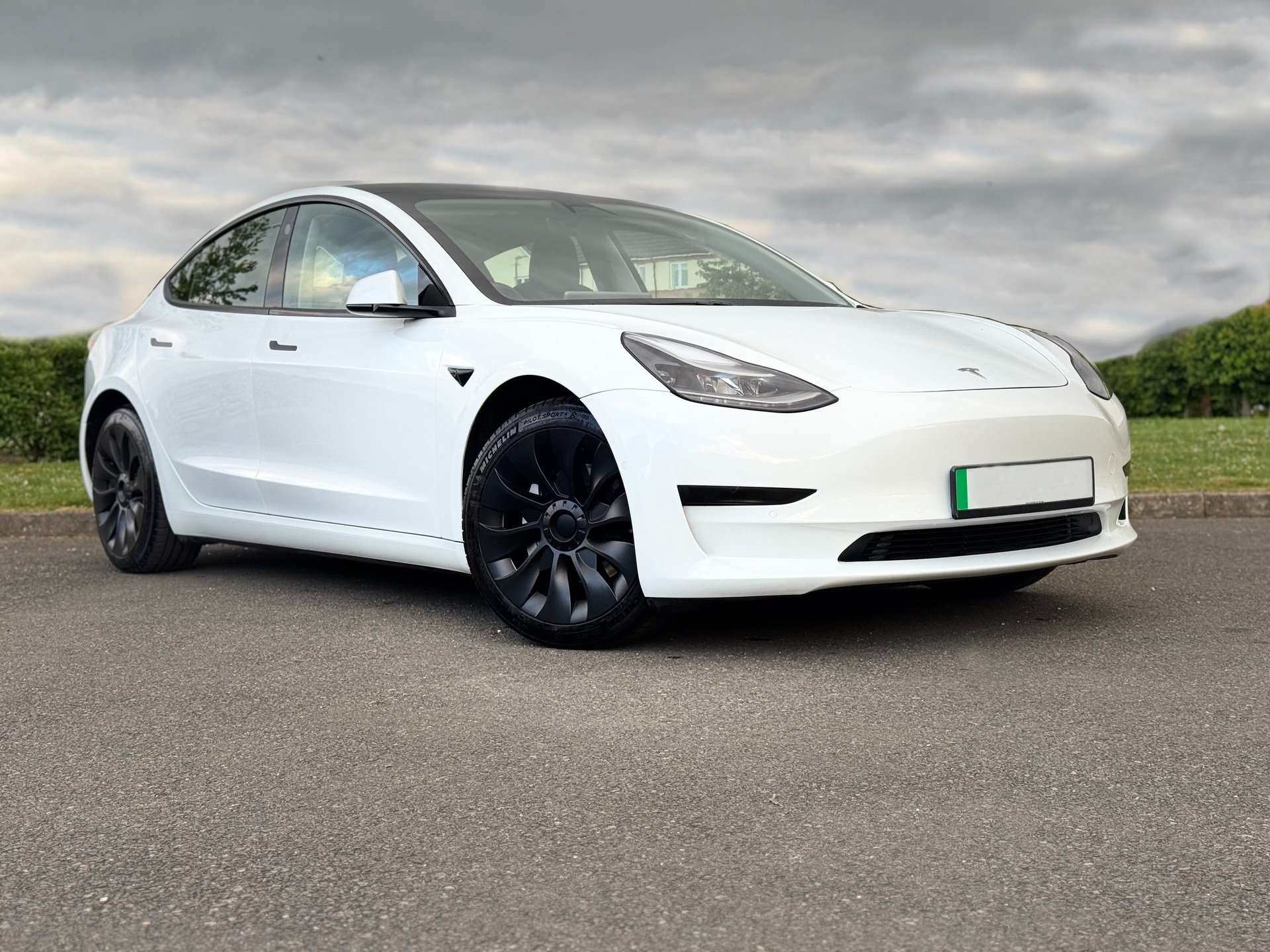 white lamborghini aventador parked in building
