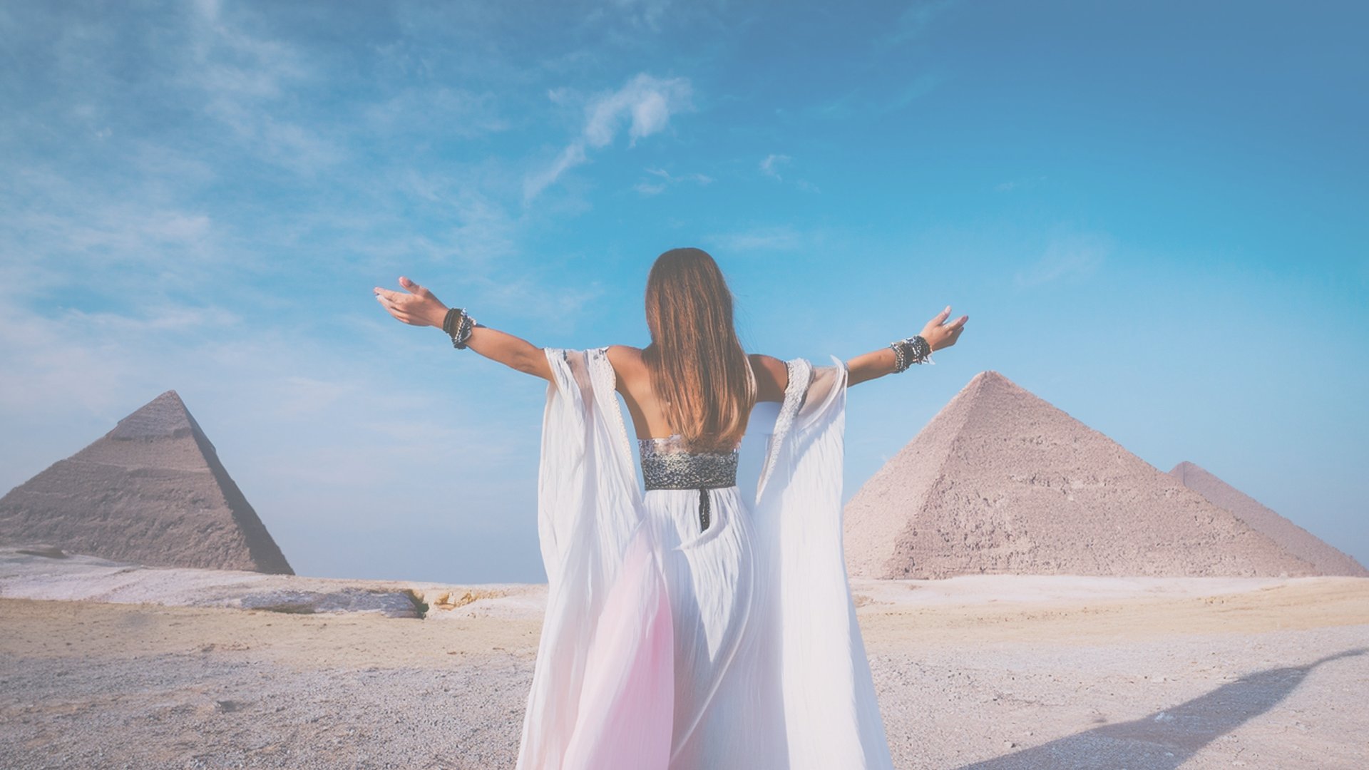 woman raising both of her hands
