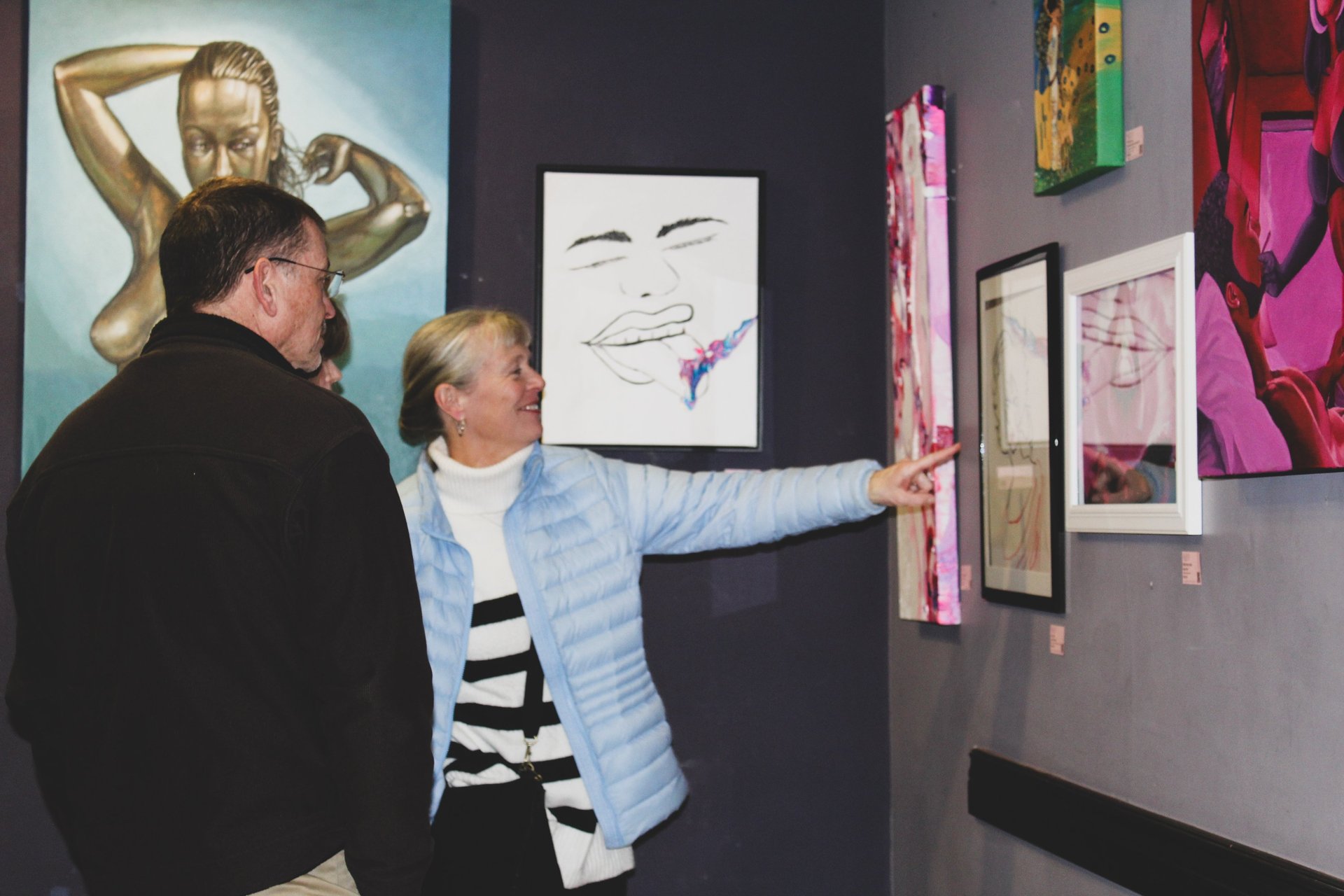 an abstract photo of a curved building with a blue sky in the background