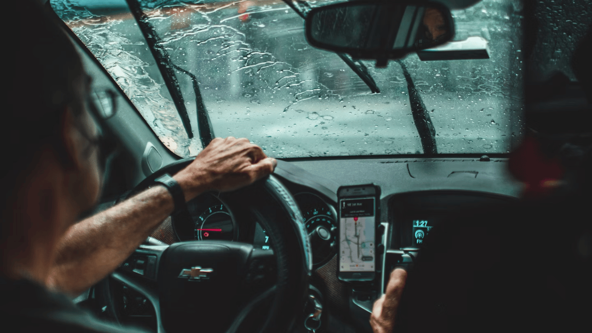 man driving car during daytime