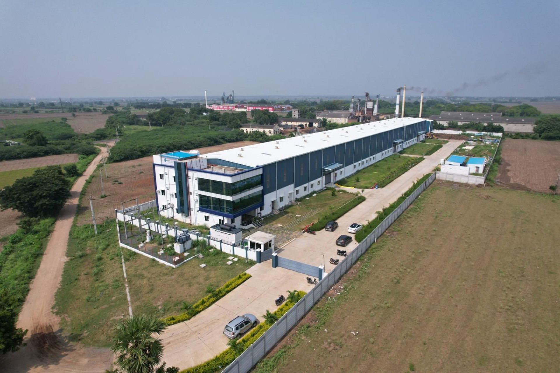 an abstract photo of a curved building with a blue sky in the background