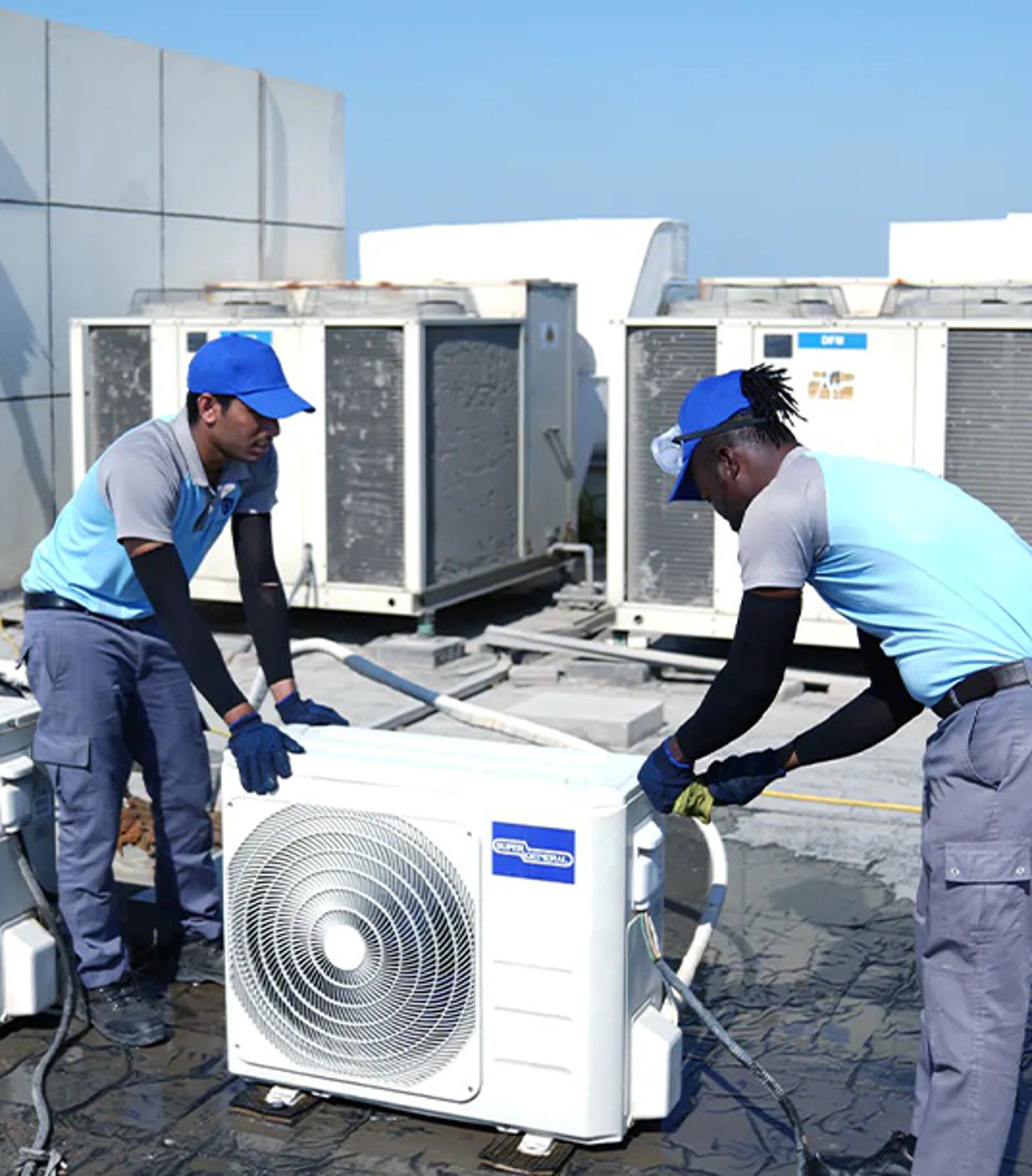 a row of air conditioners sitting on top of a tiled floor