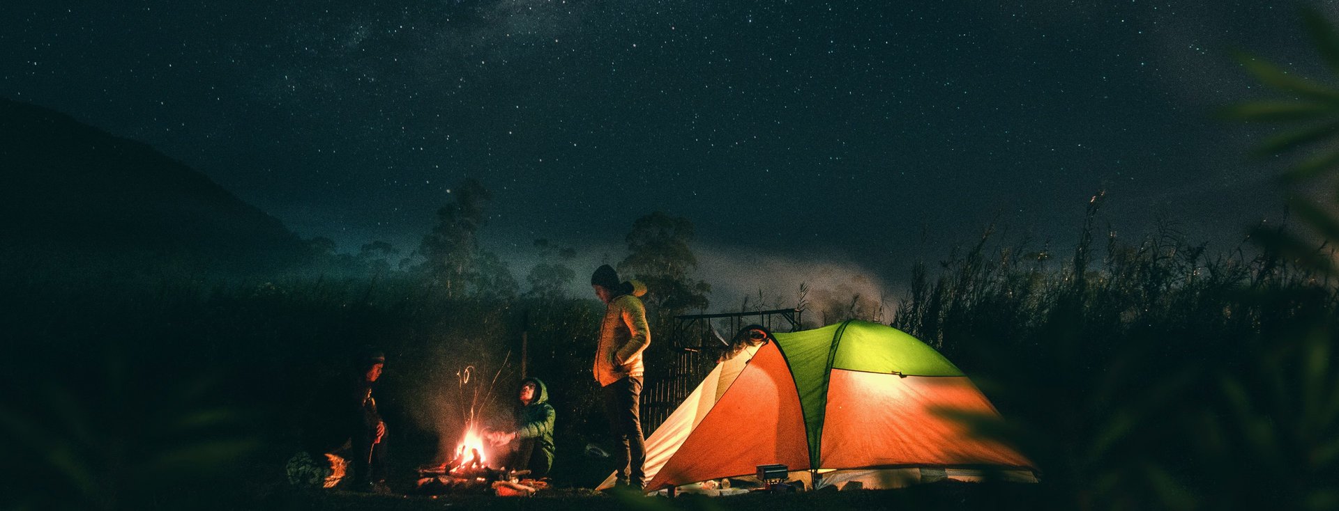 green and black tent with light inside under starry sky during nighttime