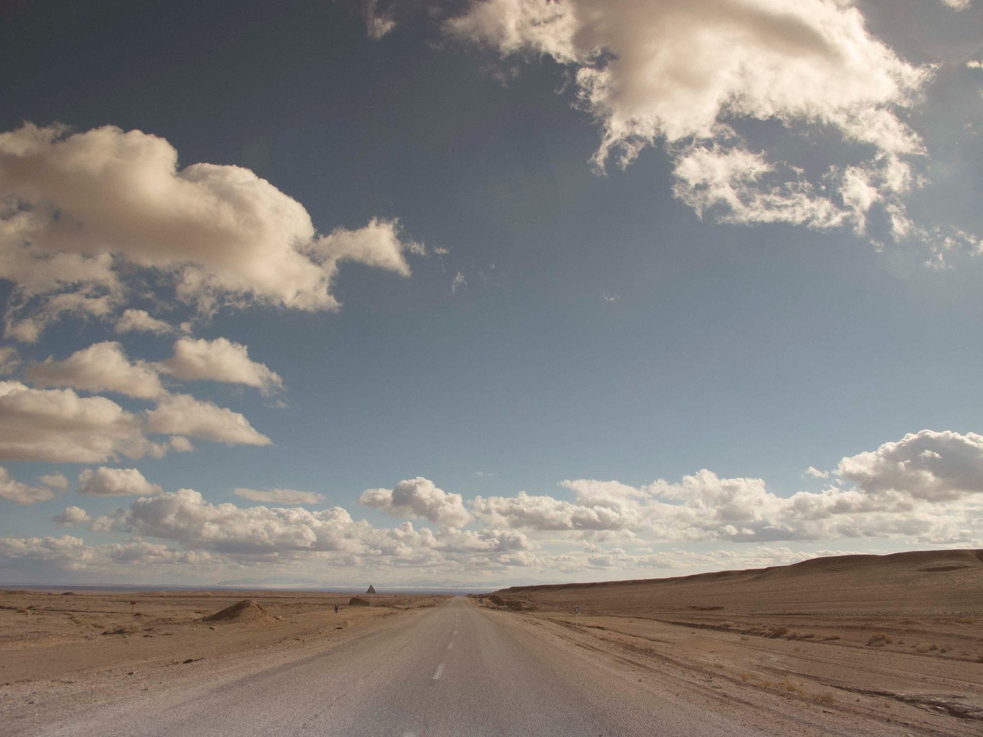 MacBook Pro near white open book