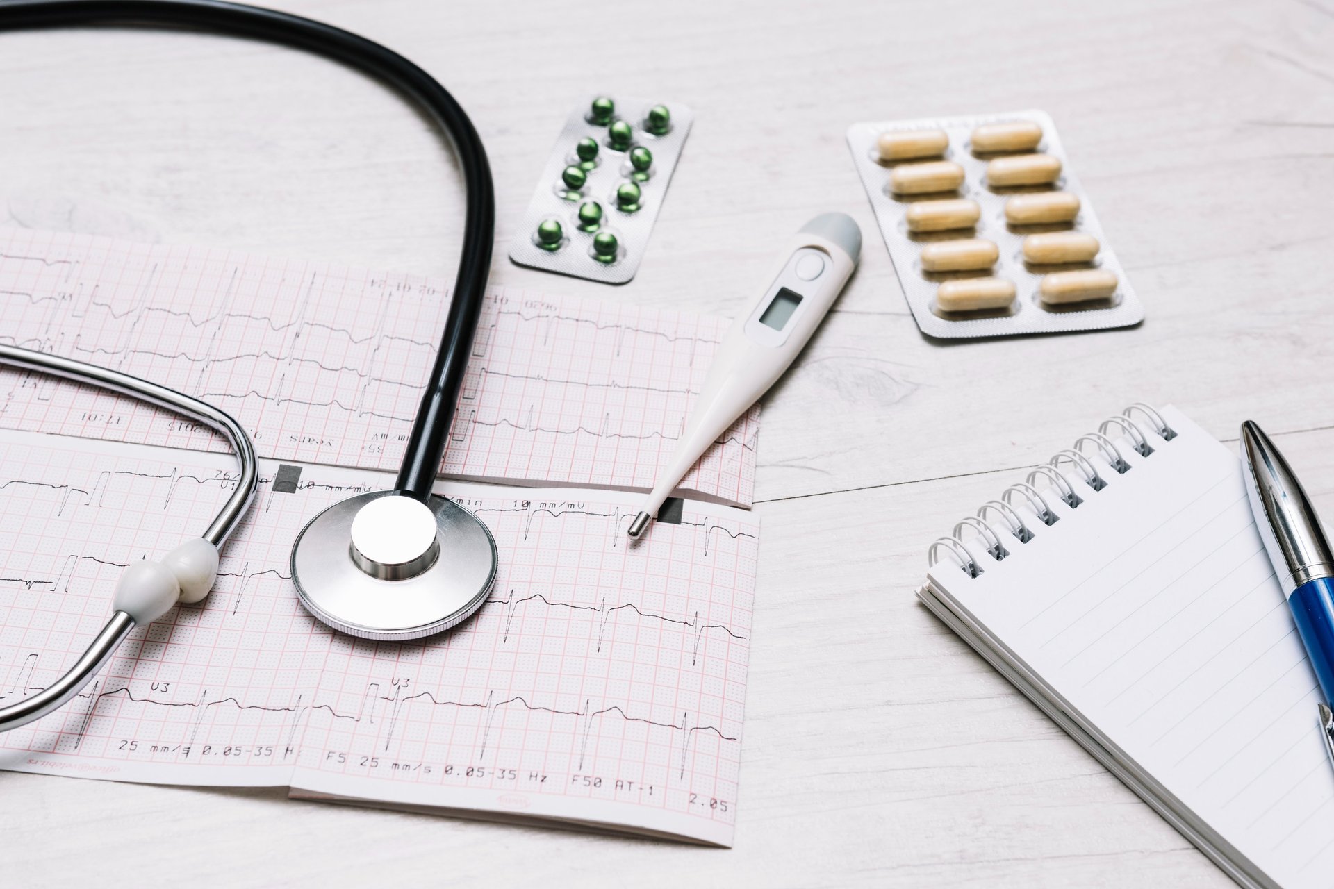 doctor holding red stethoscope