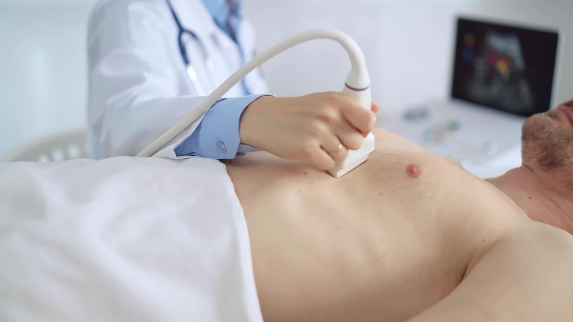 doctor holding red stethoscope