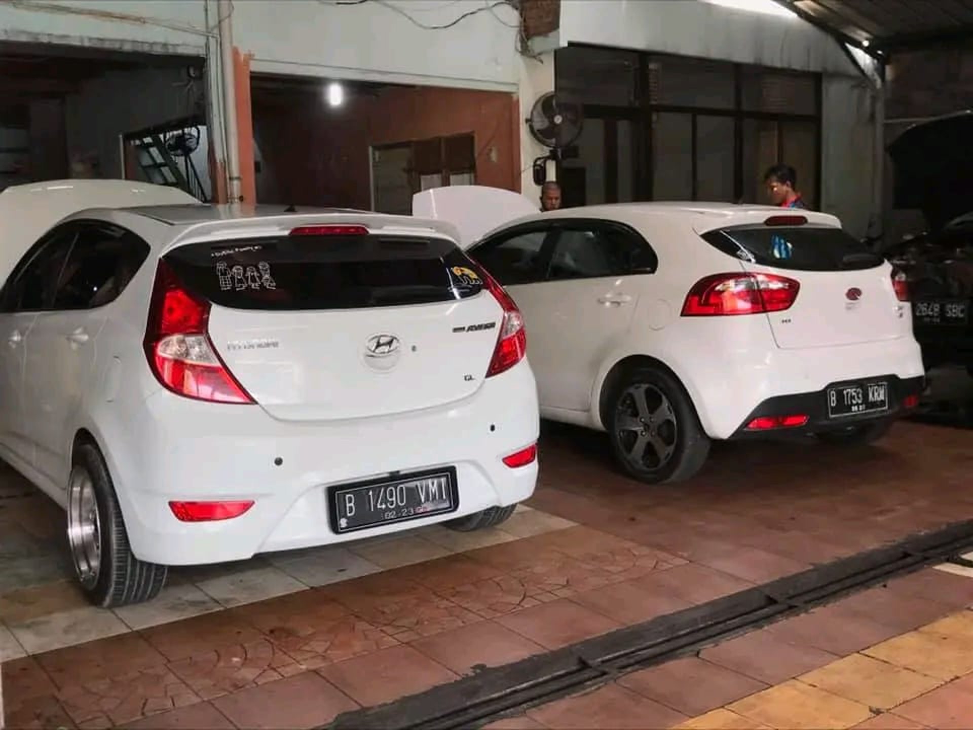 black and brown leather padded tub sofa